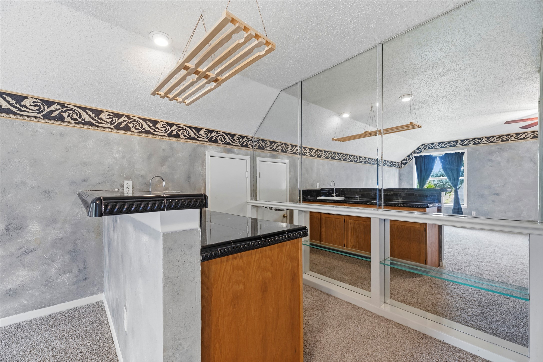 Expansive game room space with a wet bar!