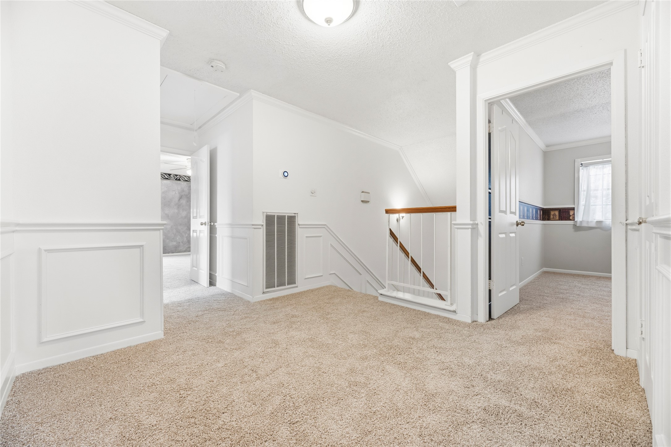 2nd floor landing which opens to 3 bedrooms, 1 full bathroom and a huge game room!