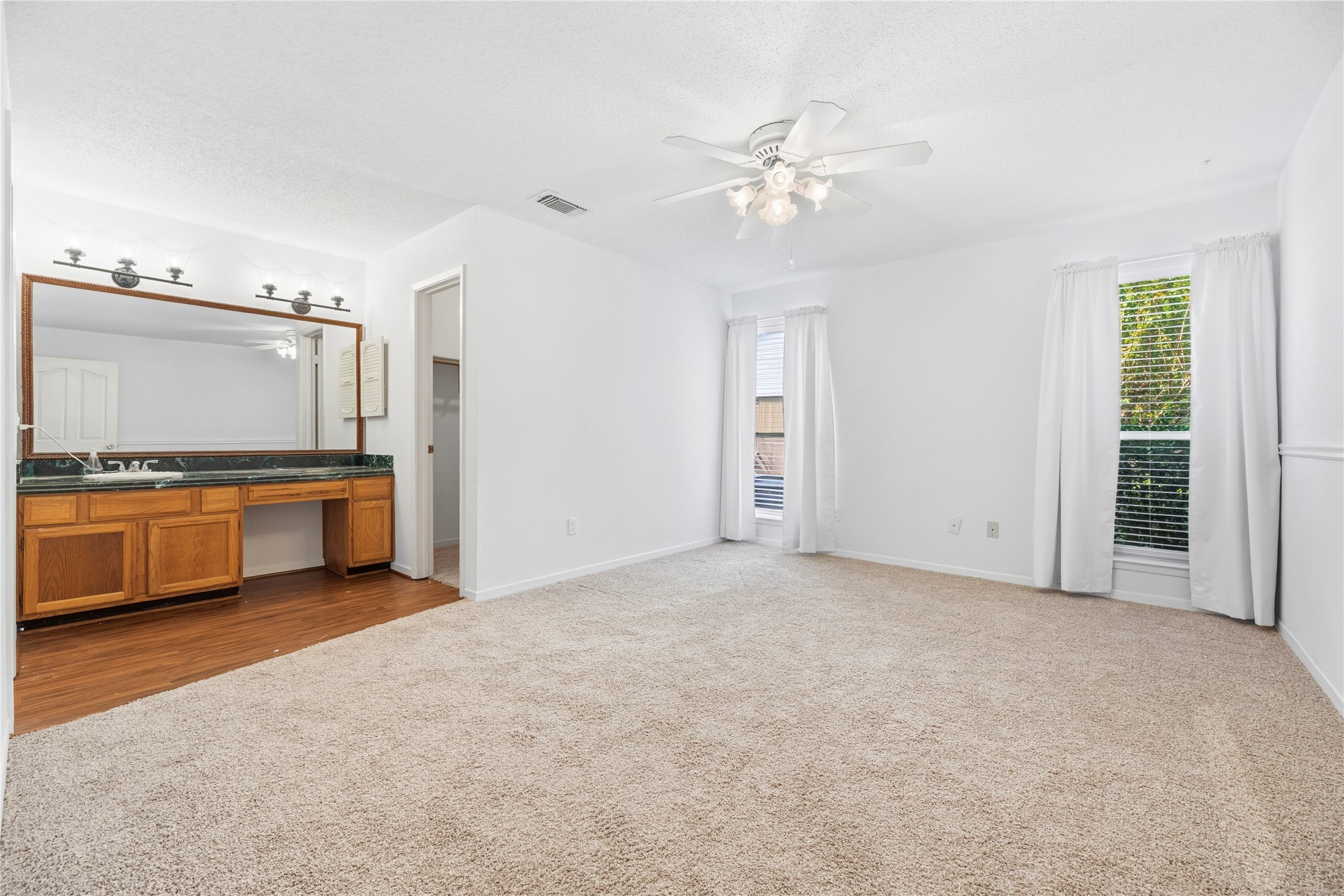 Primary suite with brand new carpet, fresh paint, and a ton of space!