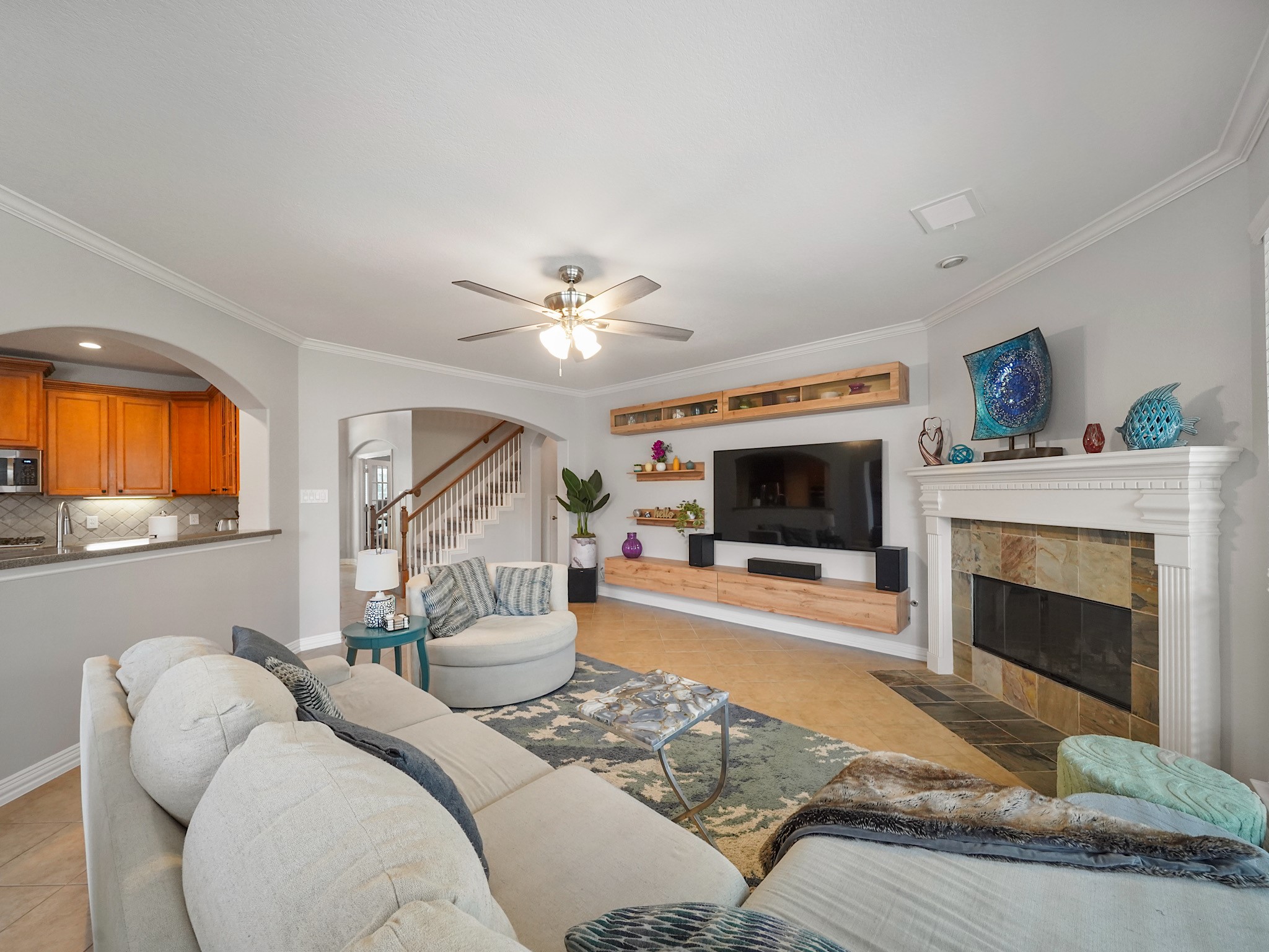 The open flow between the family room and kitchen keeps everyone connected while allowing each space to shine.