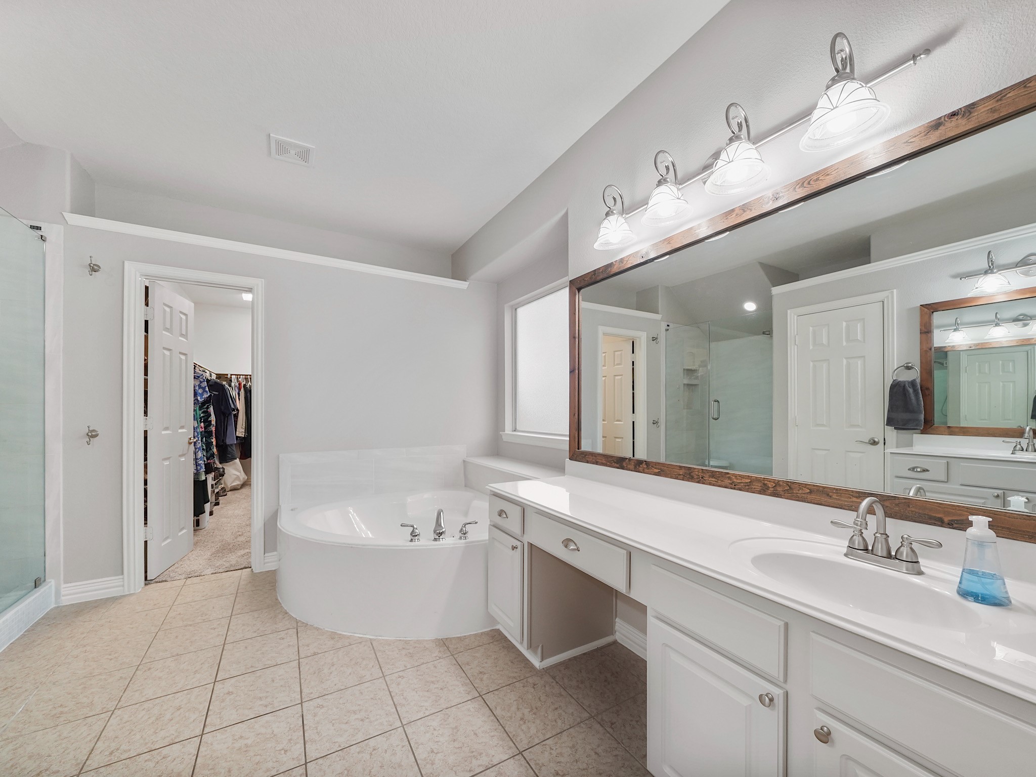 Designed for both comfort and convenience, the ensuite bath offers abundant counter space, excellent storage, and a thoughtfully planned layout.