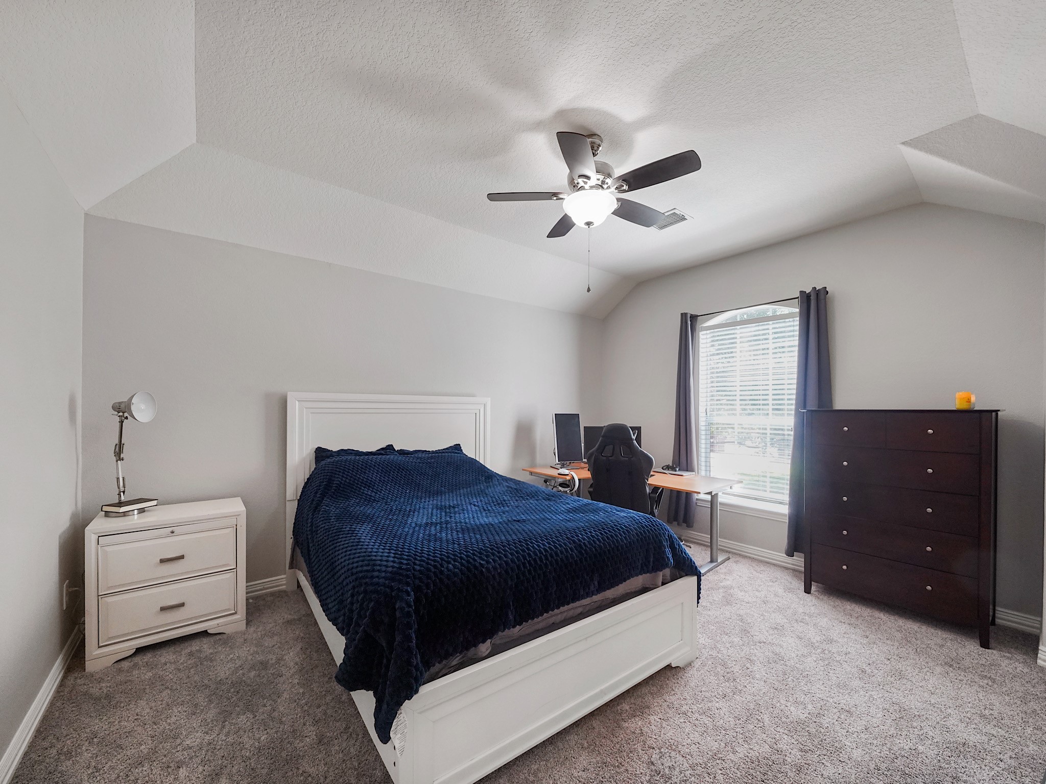 Spacious and inviting, this bedroom features abundant natural light and a large closet for exceptional storage.
