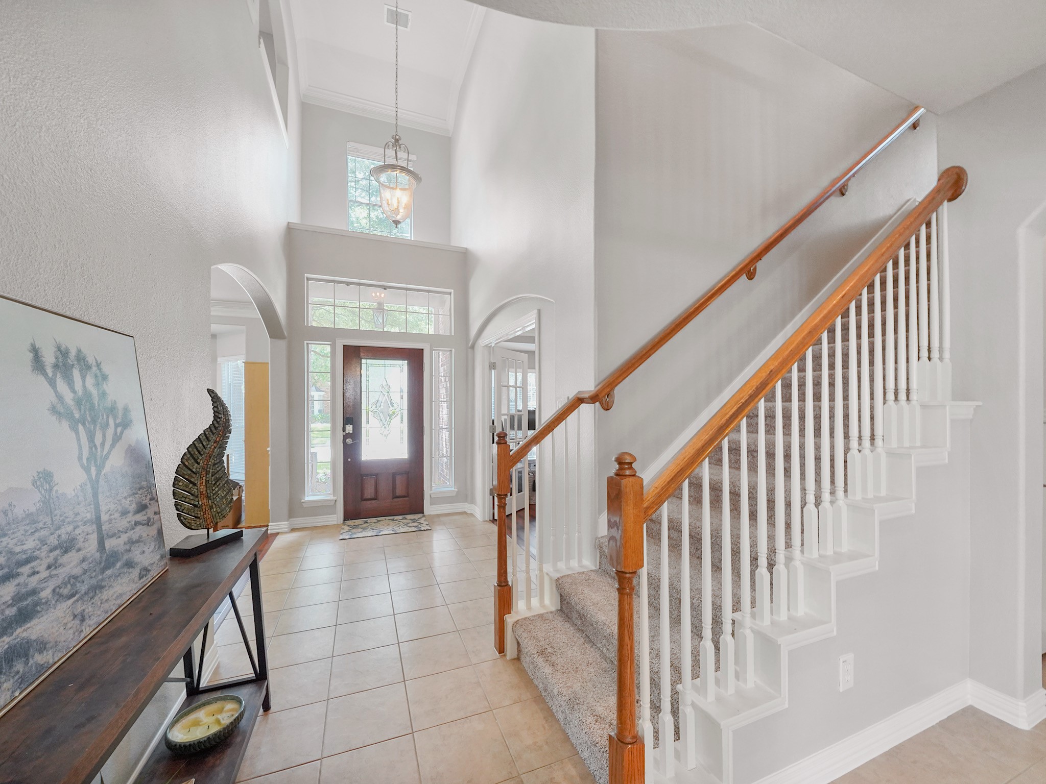 As you move through the home, open sightlines and the graceful staircase create a sense of space while drawing you toward the heart of the home.