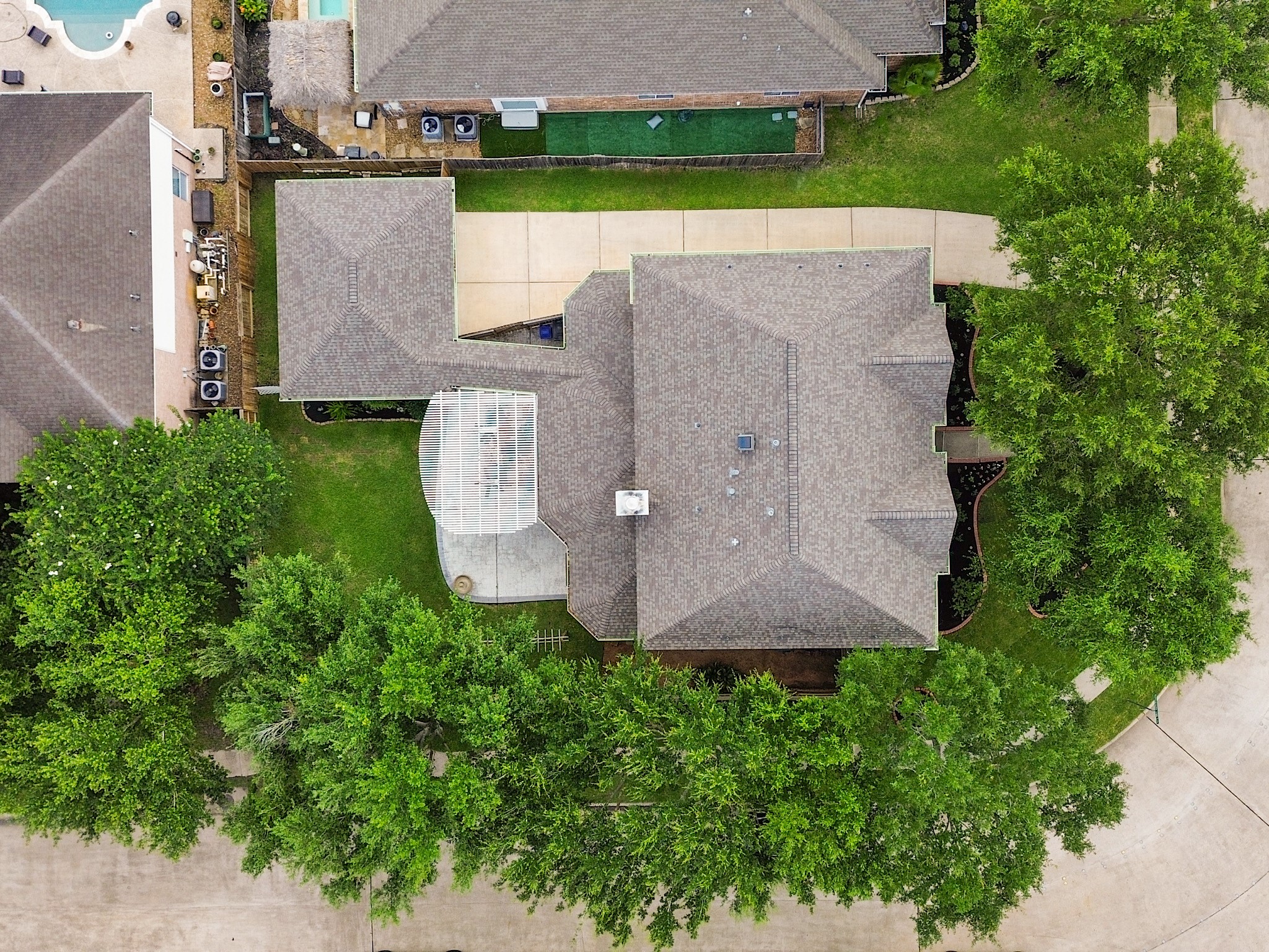 From above, you'll appreciate the mature trees, generous lot, and established setting that make this home such a special place to call home.