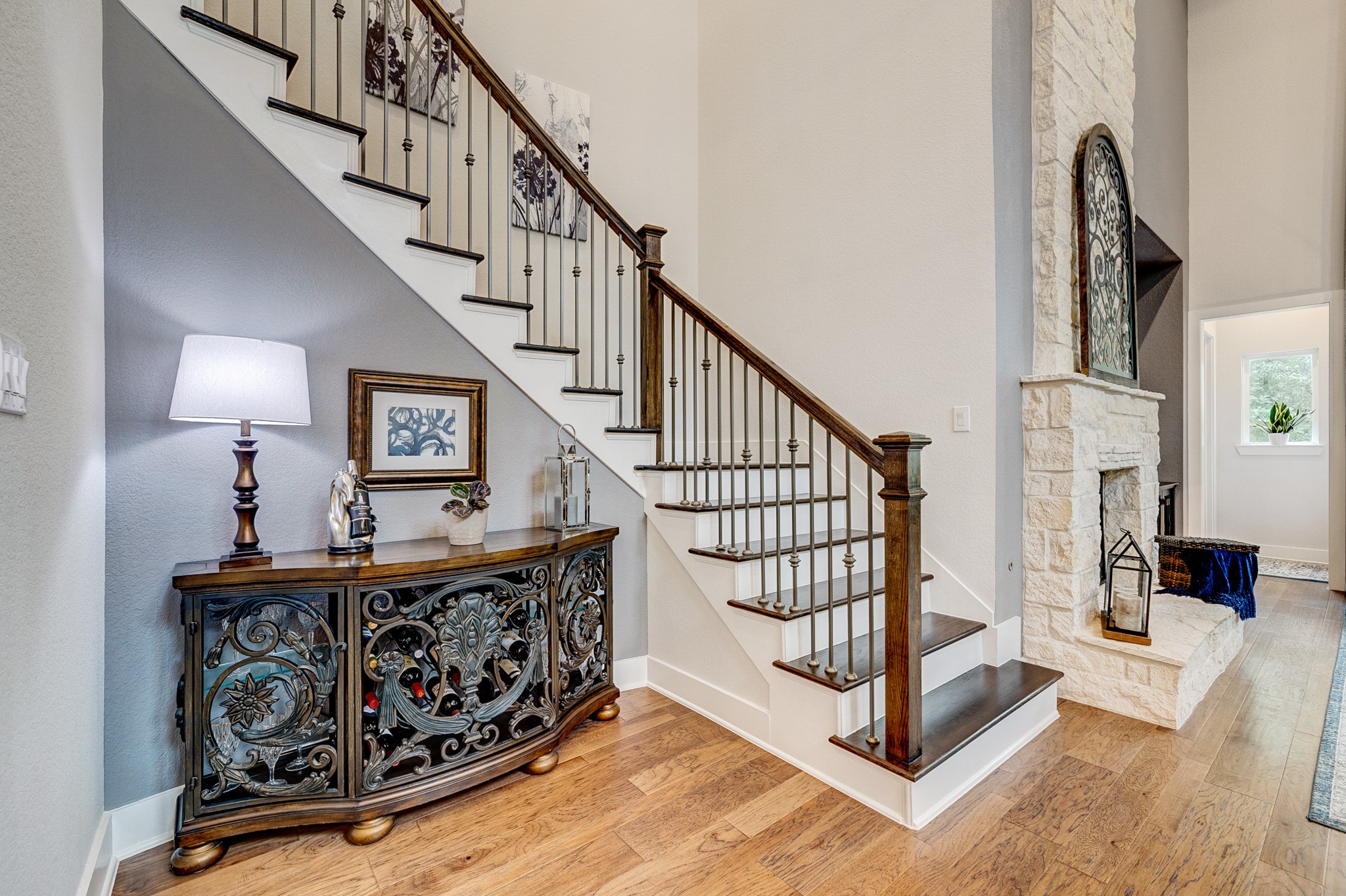 Stunning hardwood staircase featuring custom craftsmanship and upgraded finishes throughout.