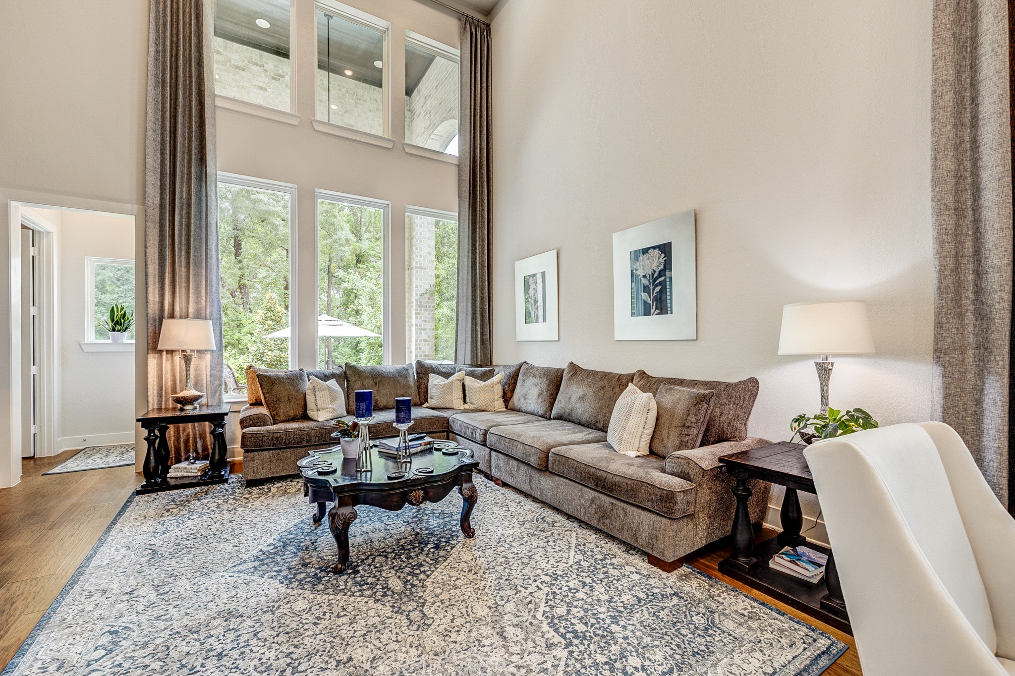 The family room is filled with abundant natural light and features an open-concept layout that flows seamlessly into the kitchen.