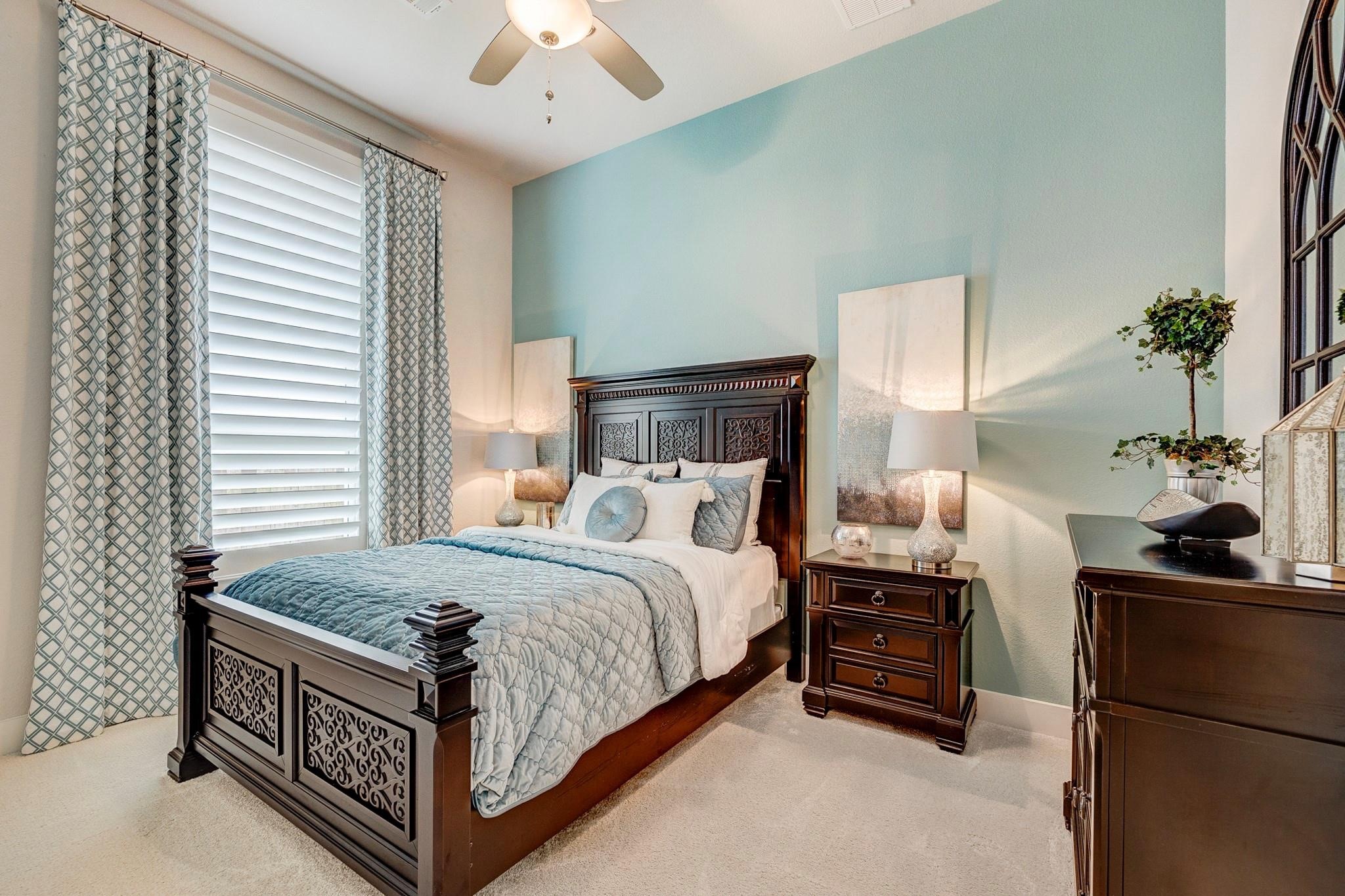 Plantation shutters, ceiling fan, and high