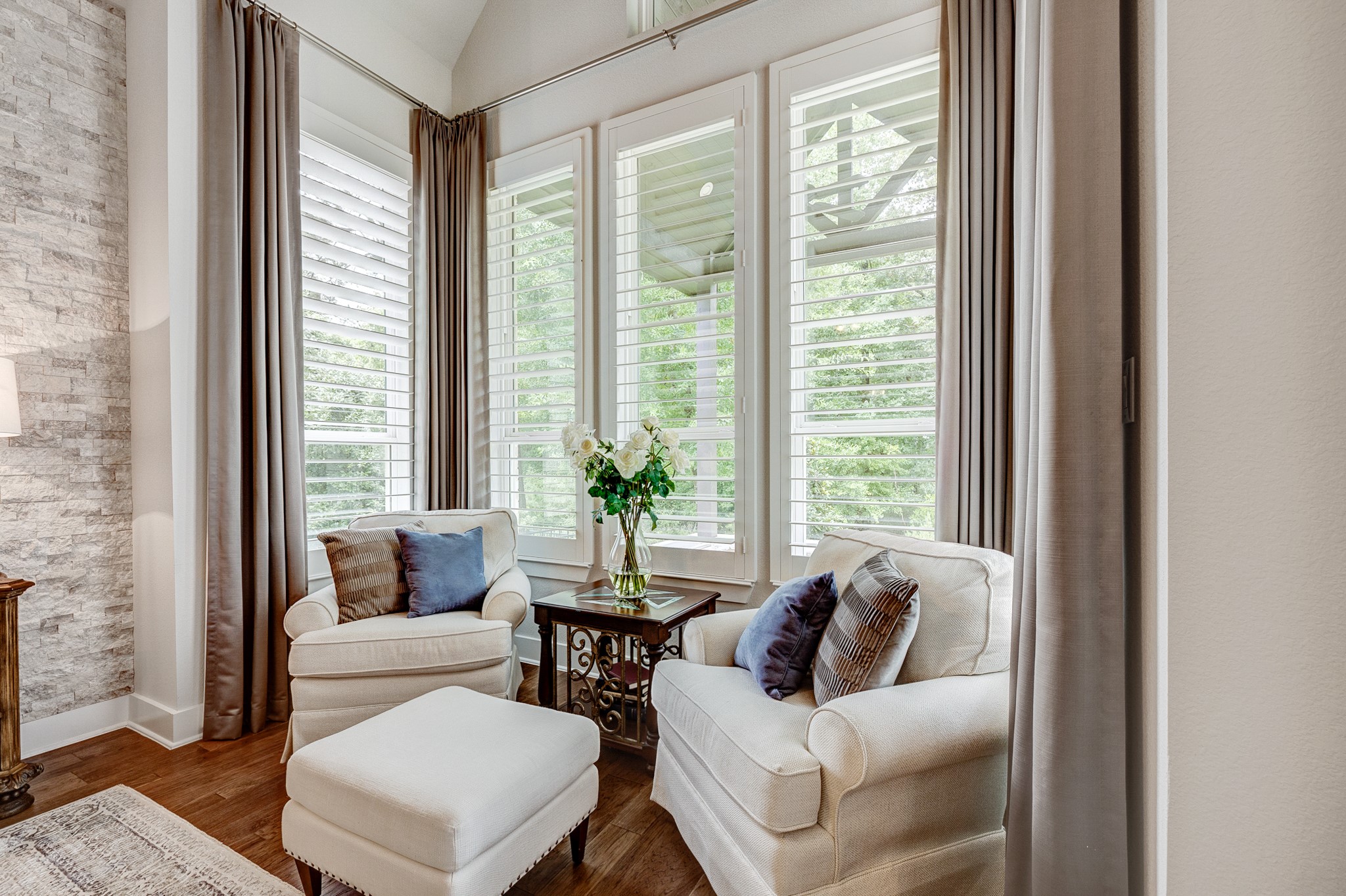 Experience ultimate relaxation in this spacious primary suite, featuring a dedicated private seating nook perfect for unwinding.