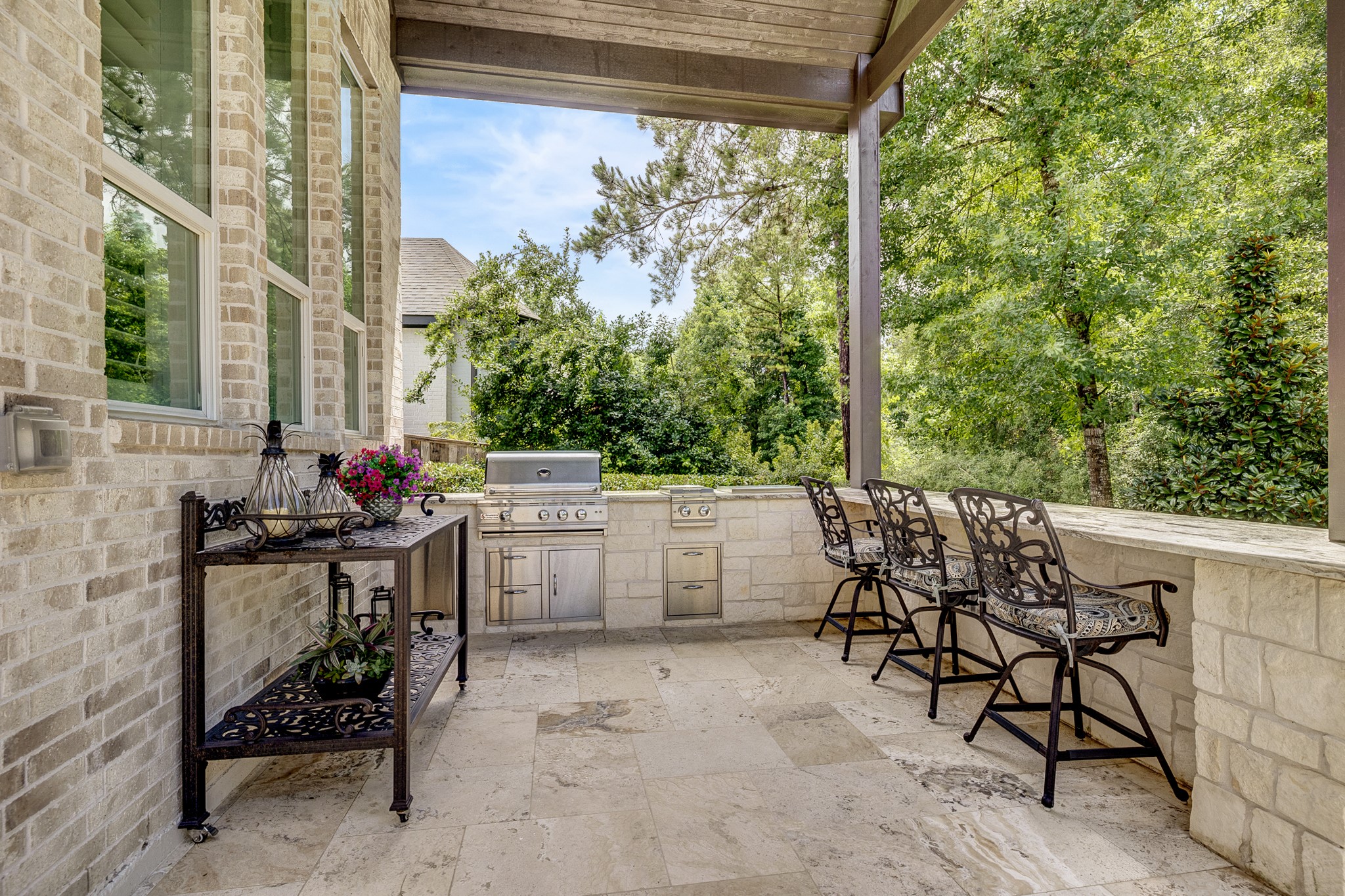 Relax outdoors overlooking no backdoor neighbors at the bar while dinner cooks on the grill