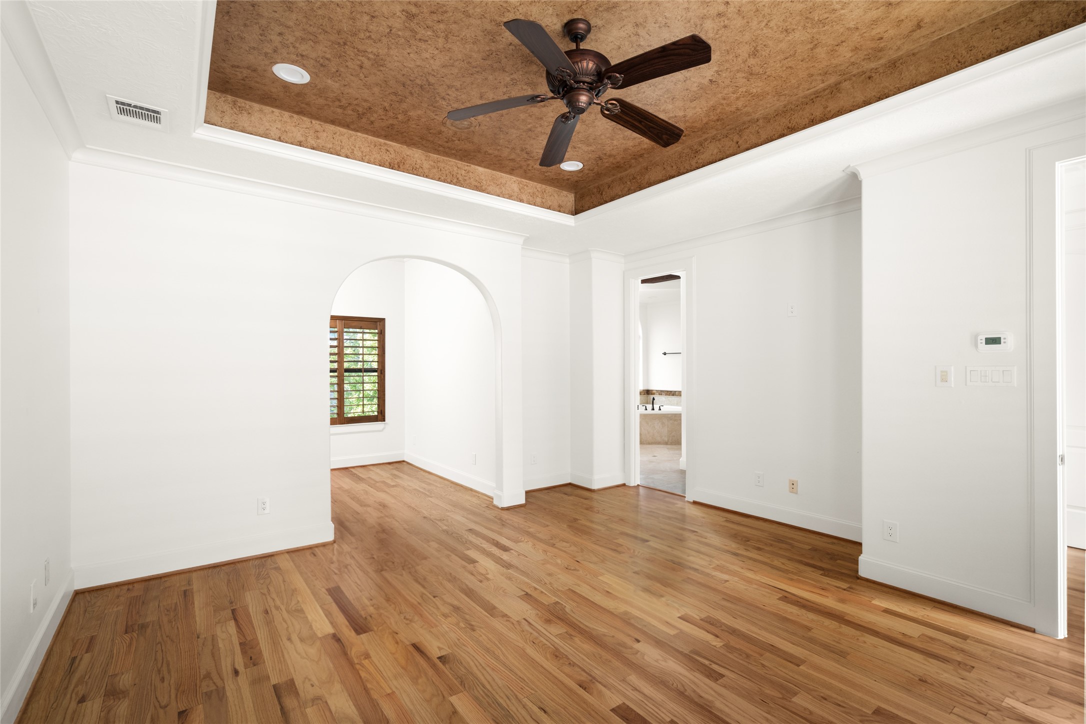 Third floor - View from primary bedroom toward office area.