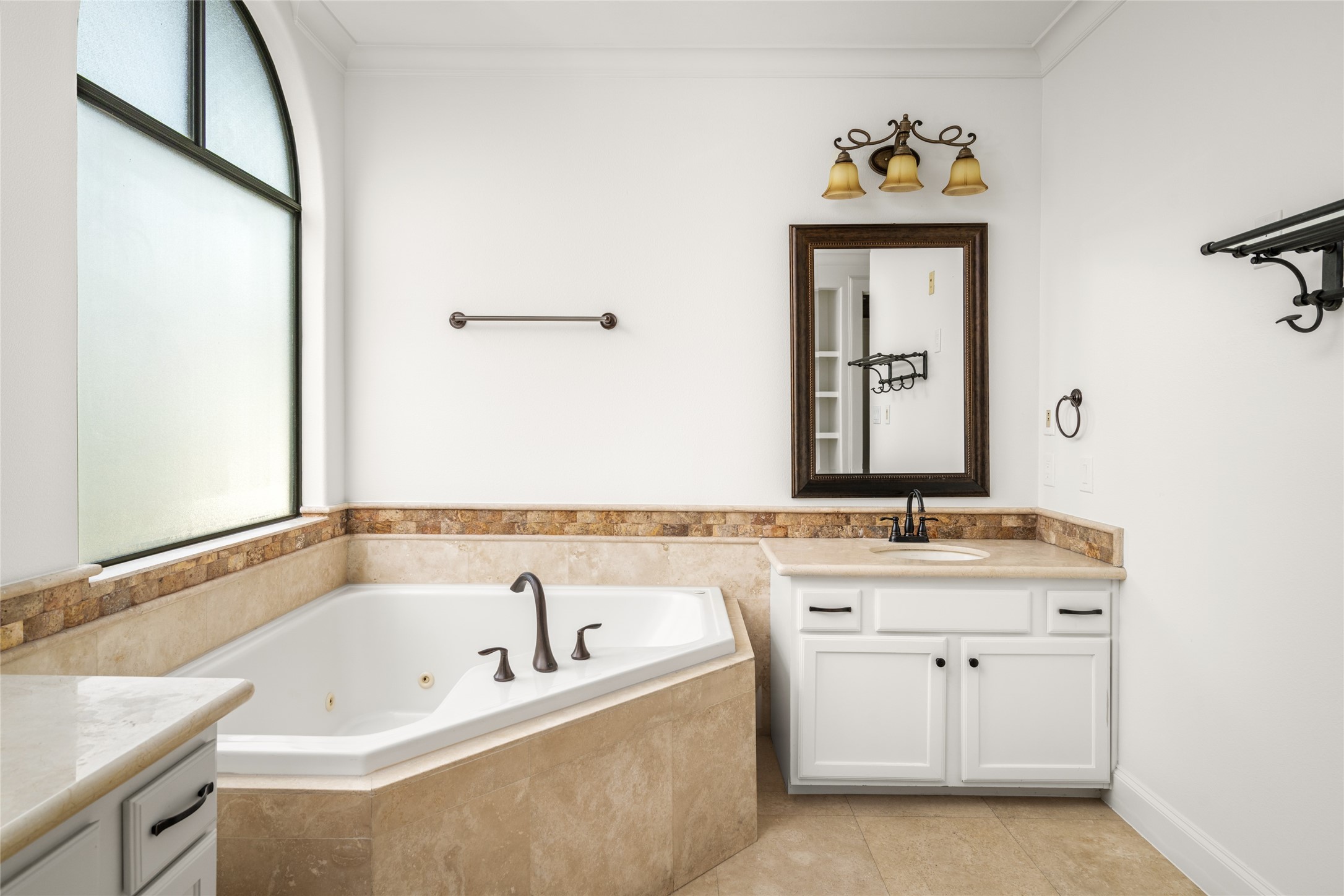 Large frosted window in the primary bathroom.