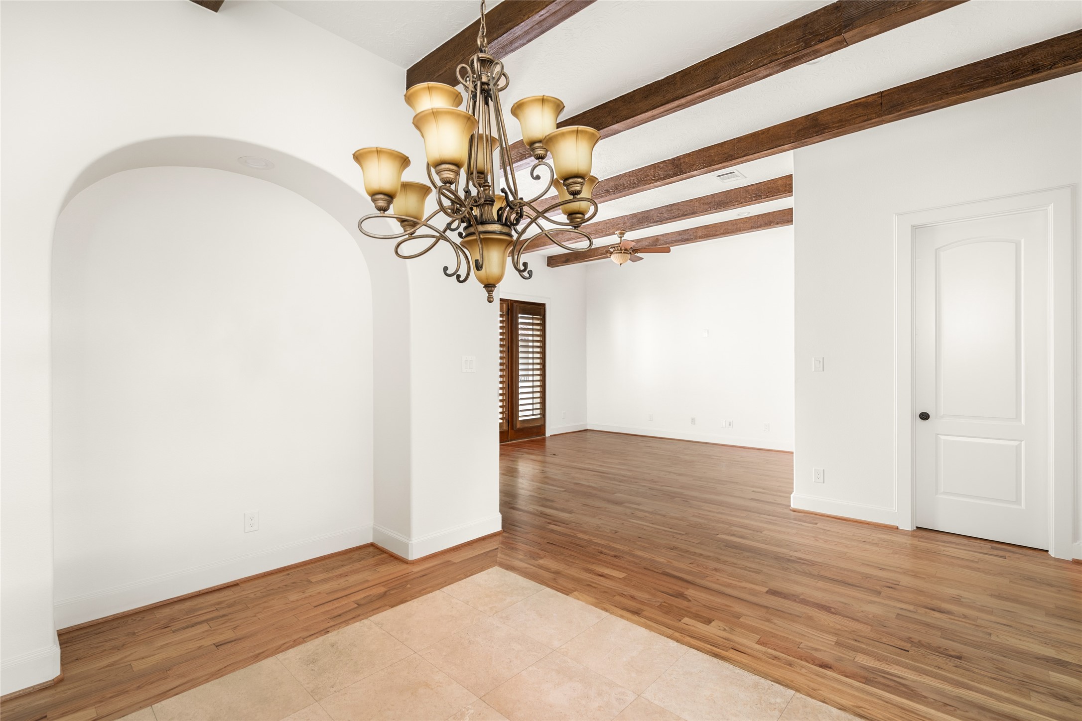 Dining room has a decorative arched wall niche.