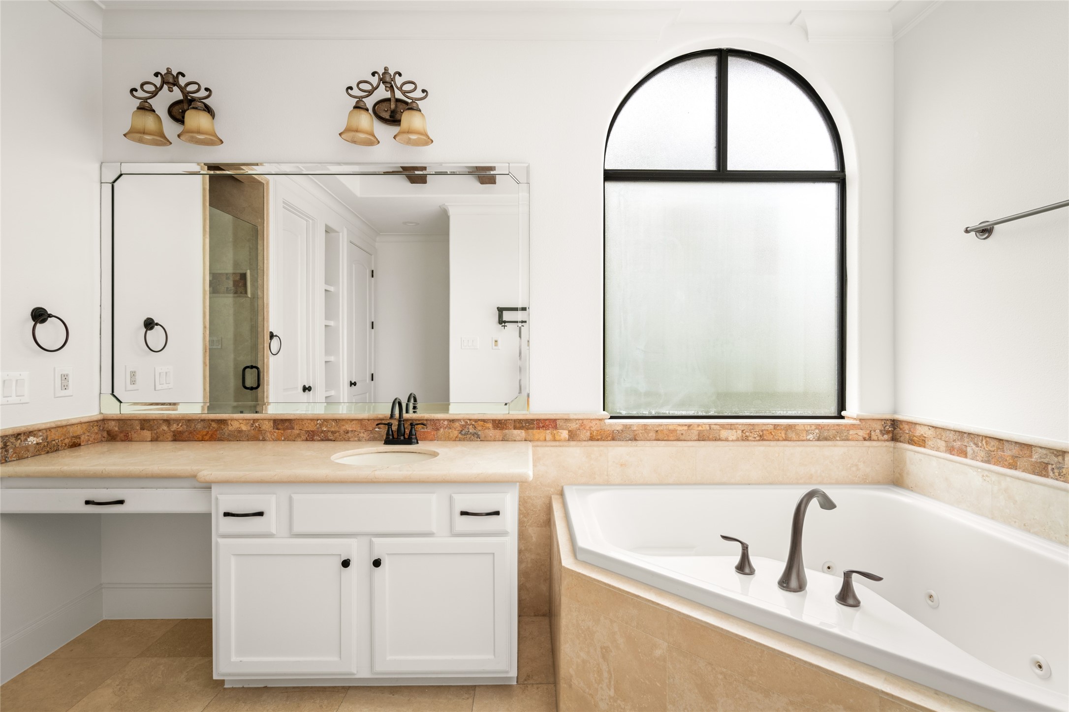 Plenty of space for two in this spacious primary bathroom.