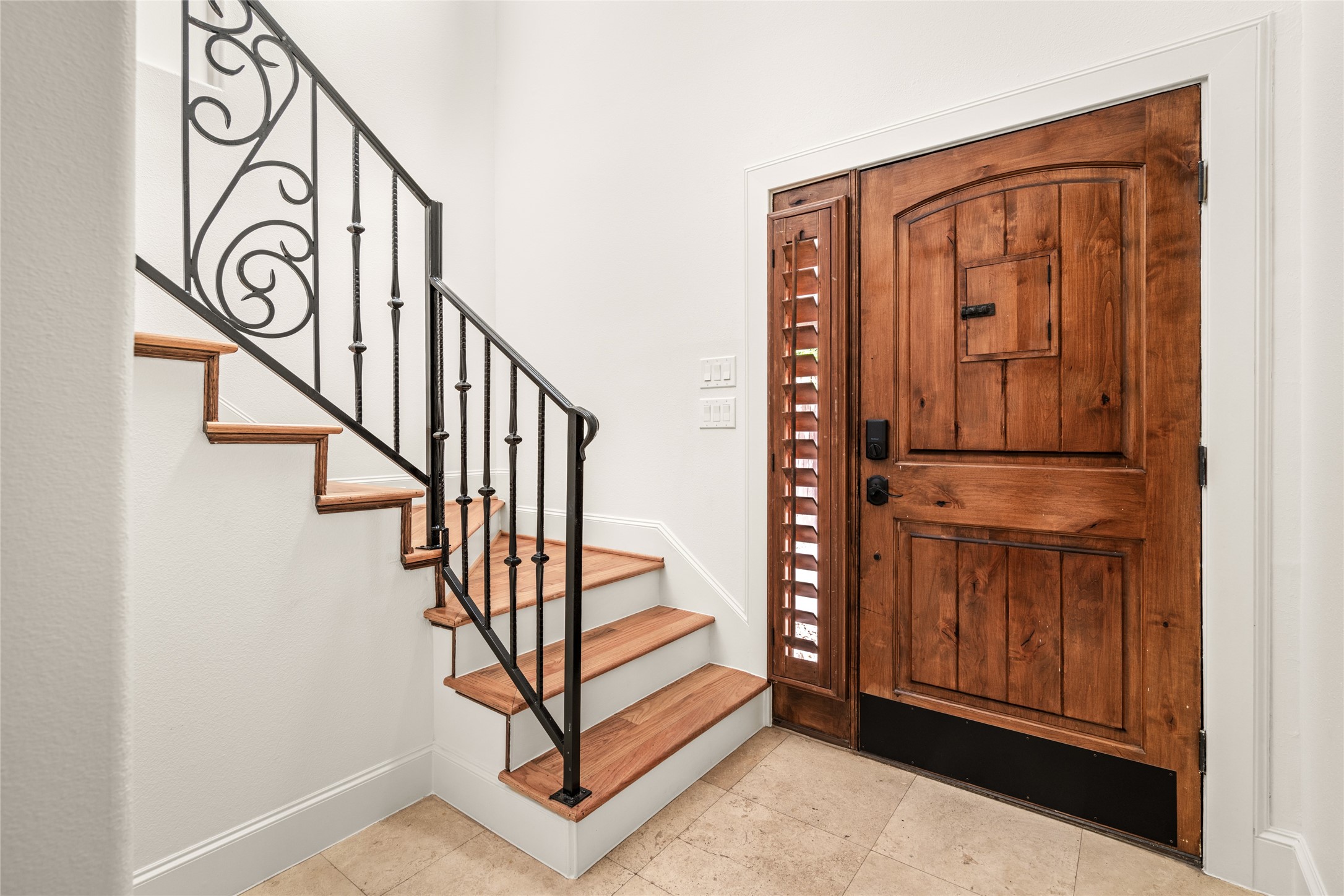 Entry door that leads to the first floor and the staircase.