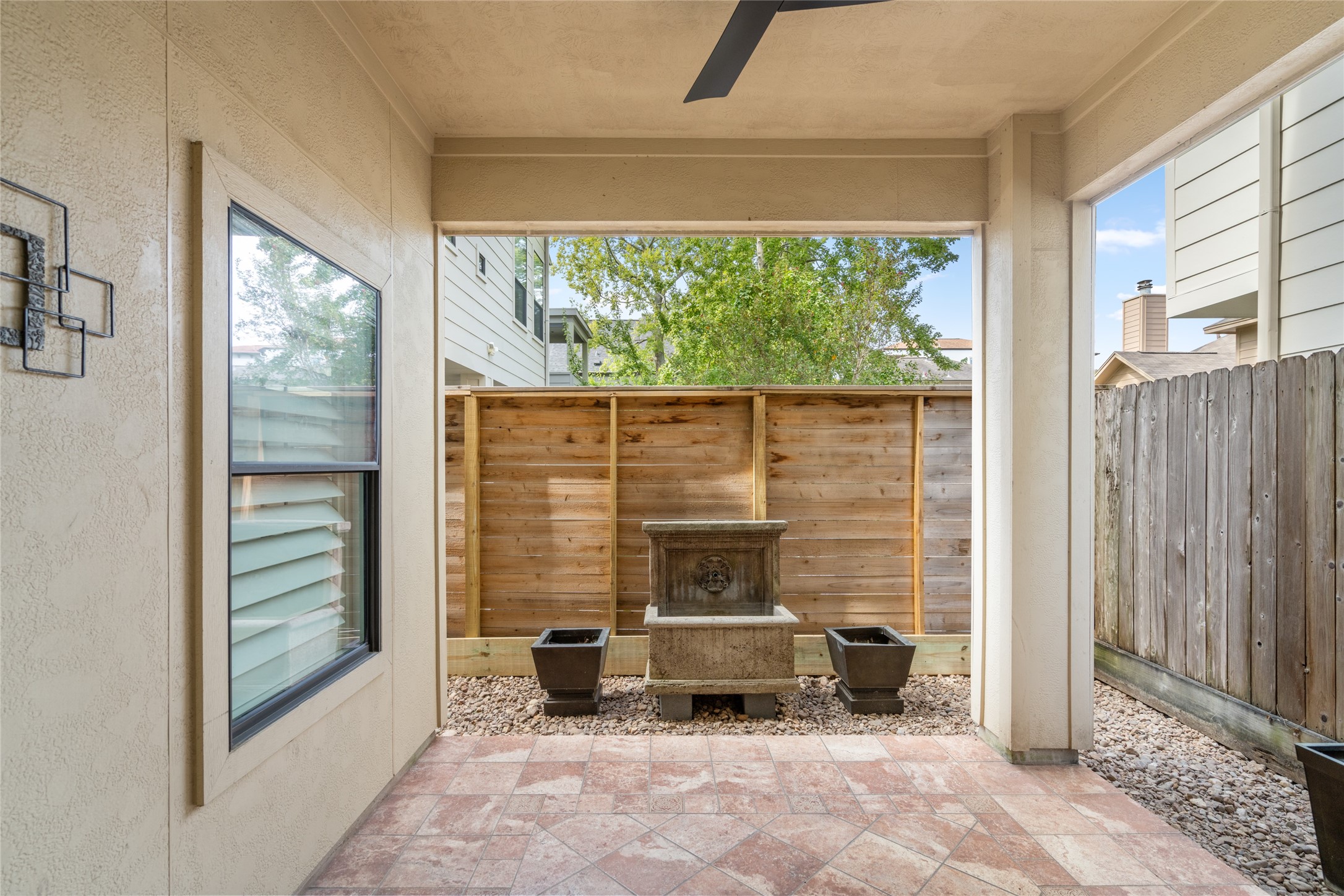 First-floor backyard patio with a fountain.