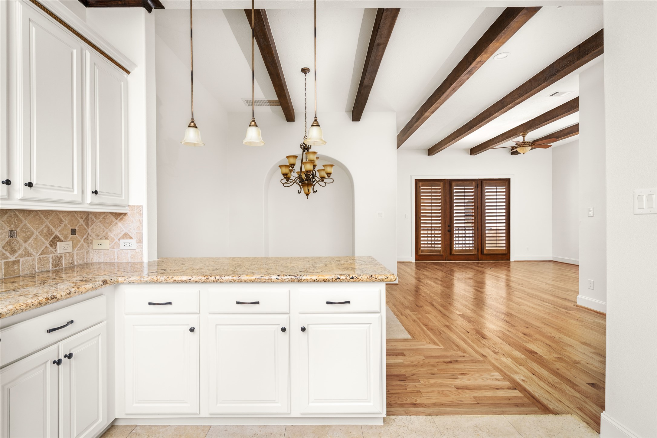 View of the dining and living areas from the kitchen.