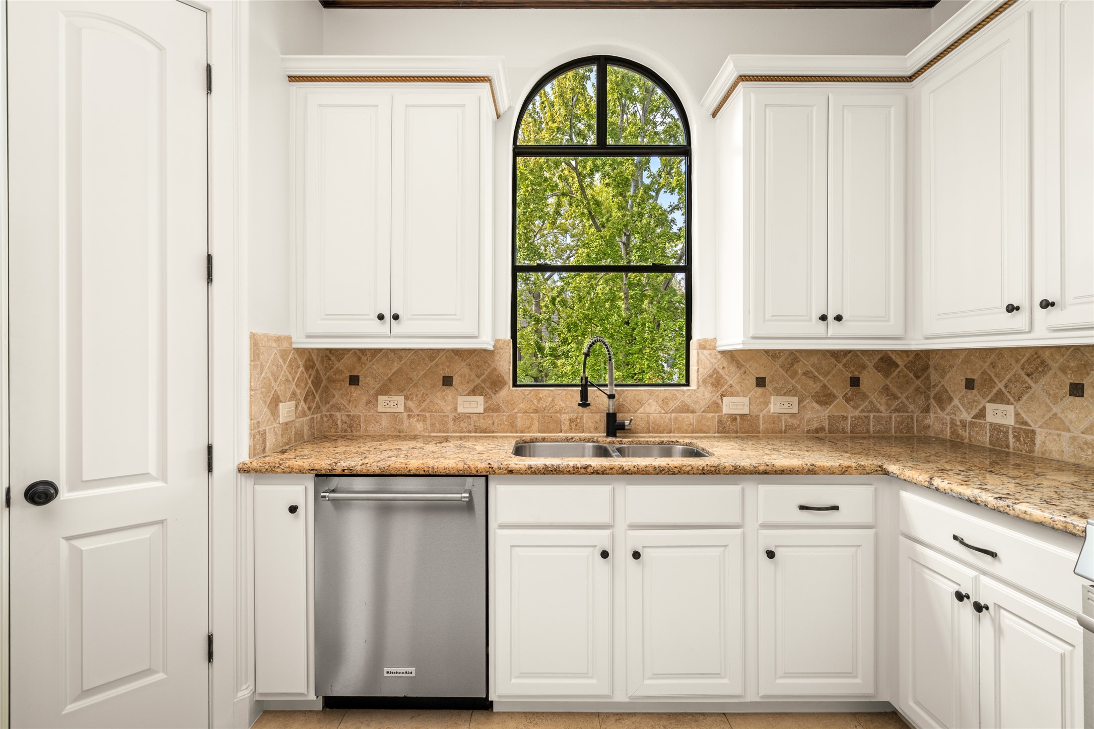 Stunning view of the nature visible through the custom kitchen window.