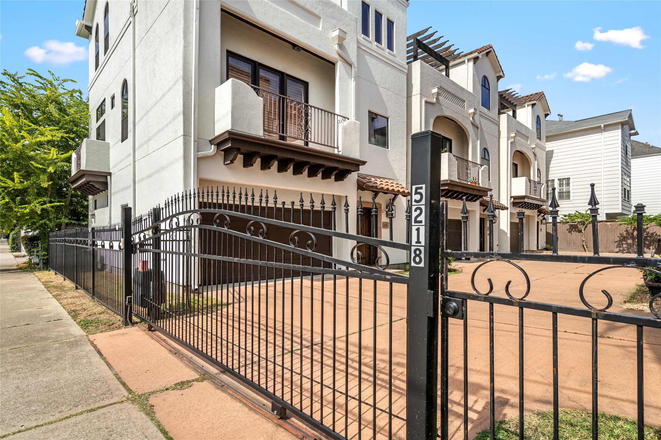 The six-townhome community has a security gate.