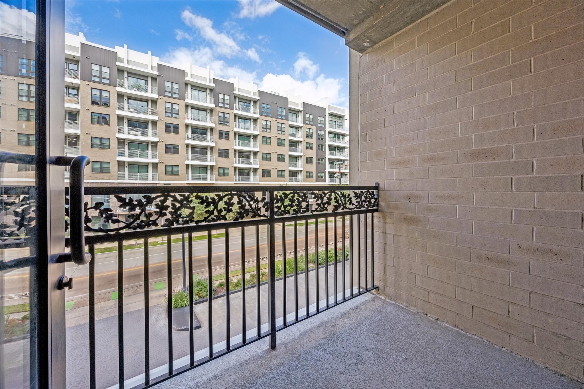 The private balcony offers an outdoor retreat overlooking the surrounding neighborhood and nearby residential buildings. A wonderful place to enjoy fresh air and the convenience of Inner Loop living.