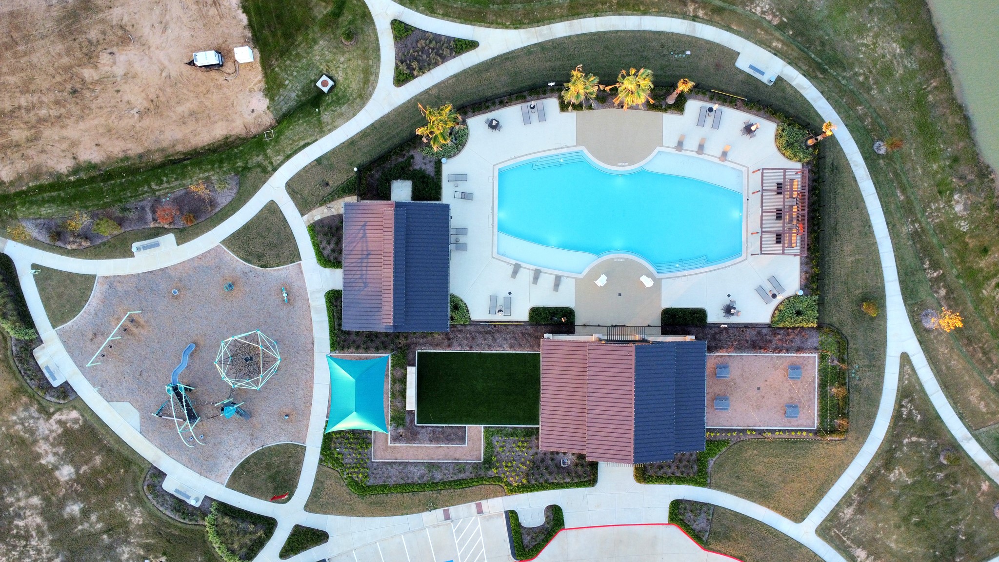 A resort-style community pool offers a refreshing escape from the Texas heat, promising endless splashy fun and relaxation