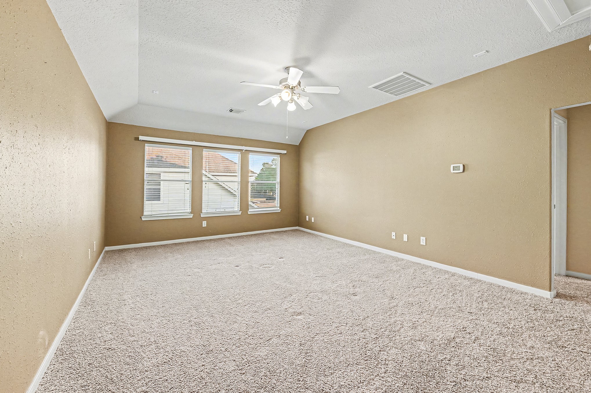 One view of oversized gameroom without furniture.