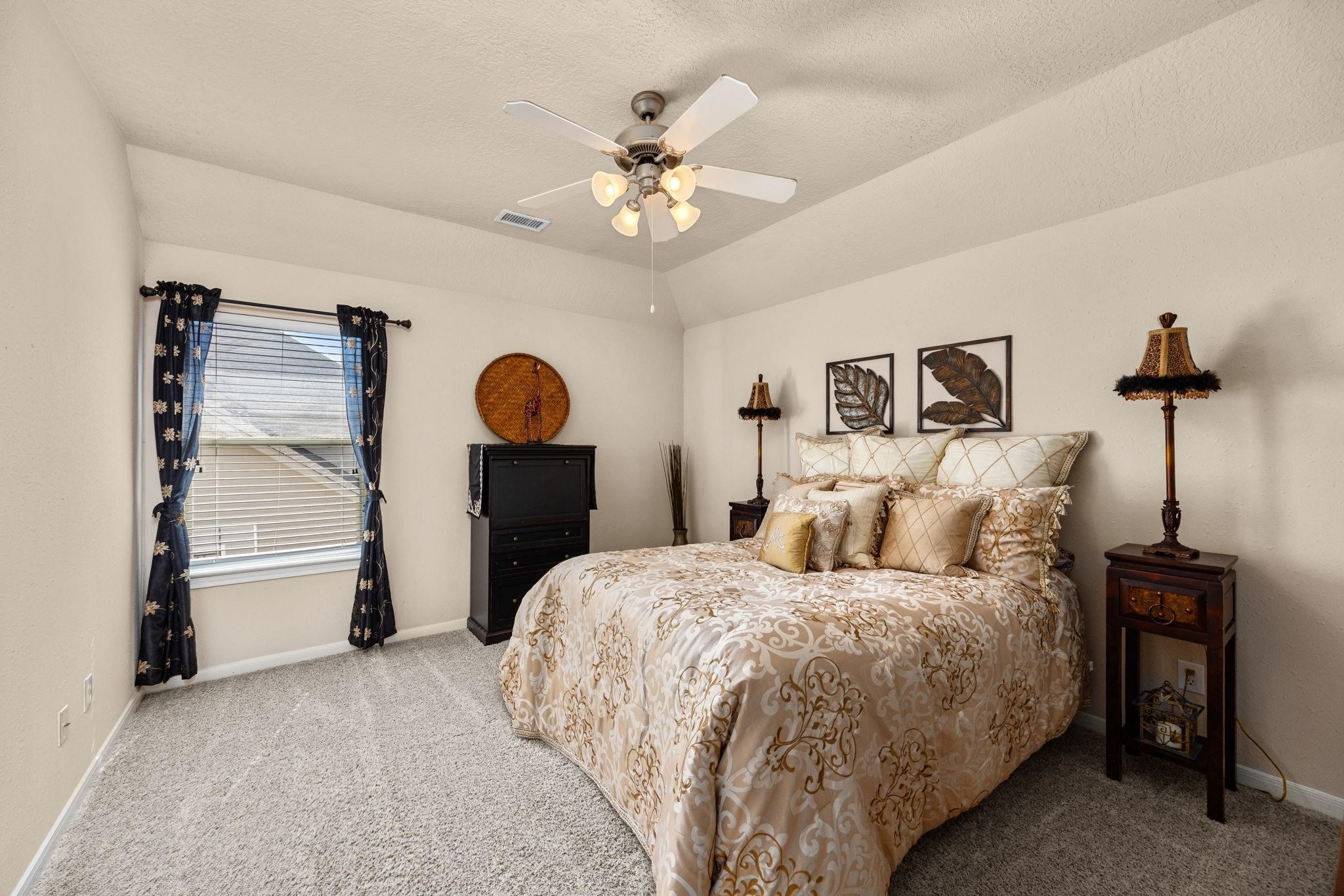 This virtually staged nice size bedroom upstairs with freize carpet and walk in closet.