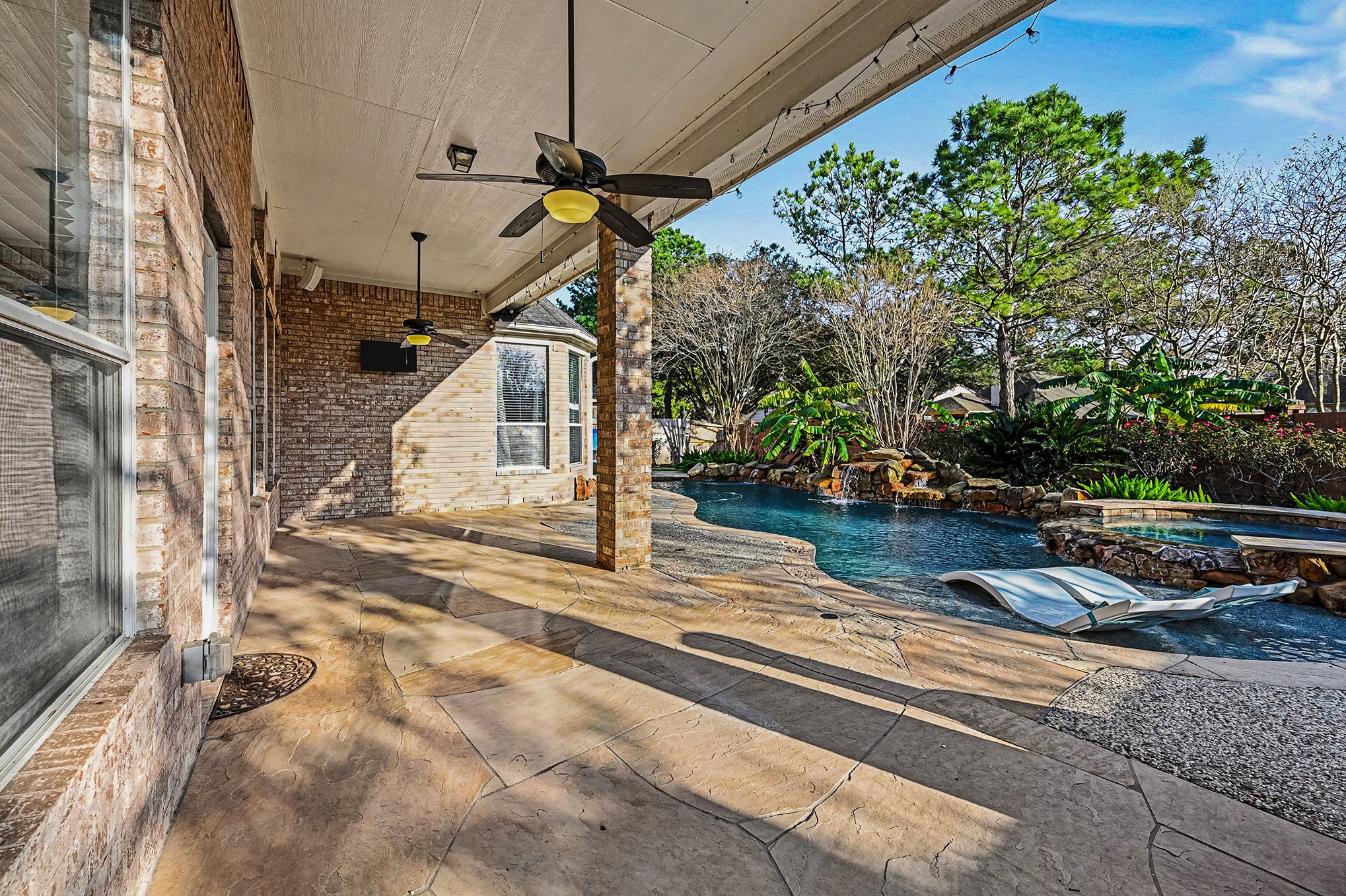 This photo shows how oversized the patio is with ceiling fans and lights.