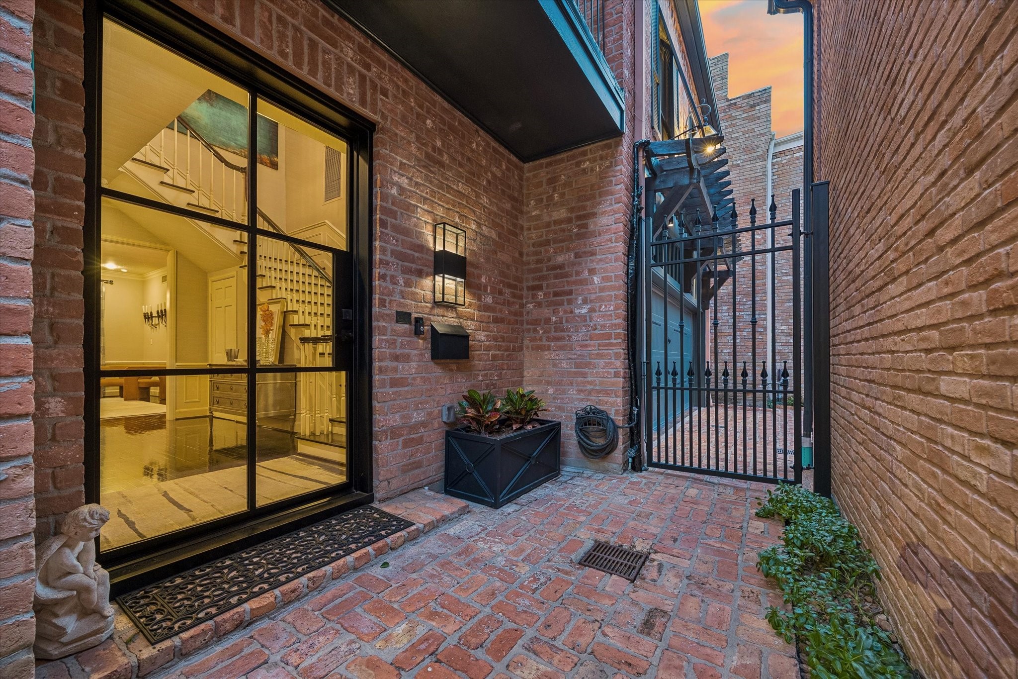 Through the custom steel + glass door a private world of beauty and quality of life awaits.