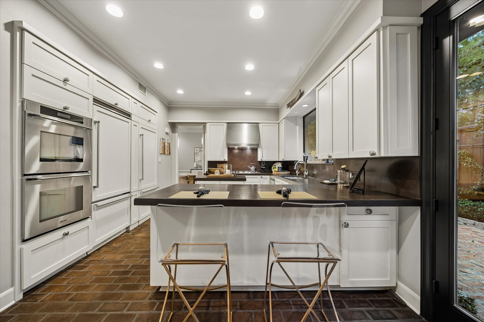 The inner chef in you will also love the TWO Thermador ovens.  Your spectators will love the Breakfast Bar.