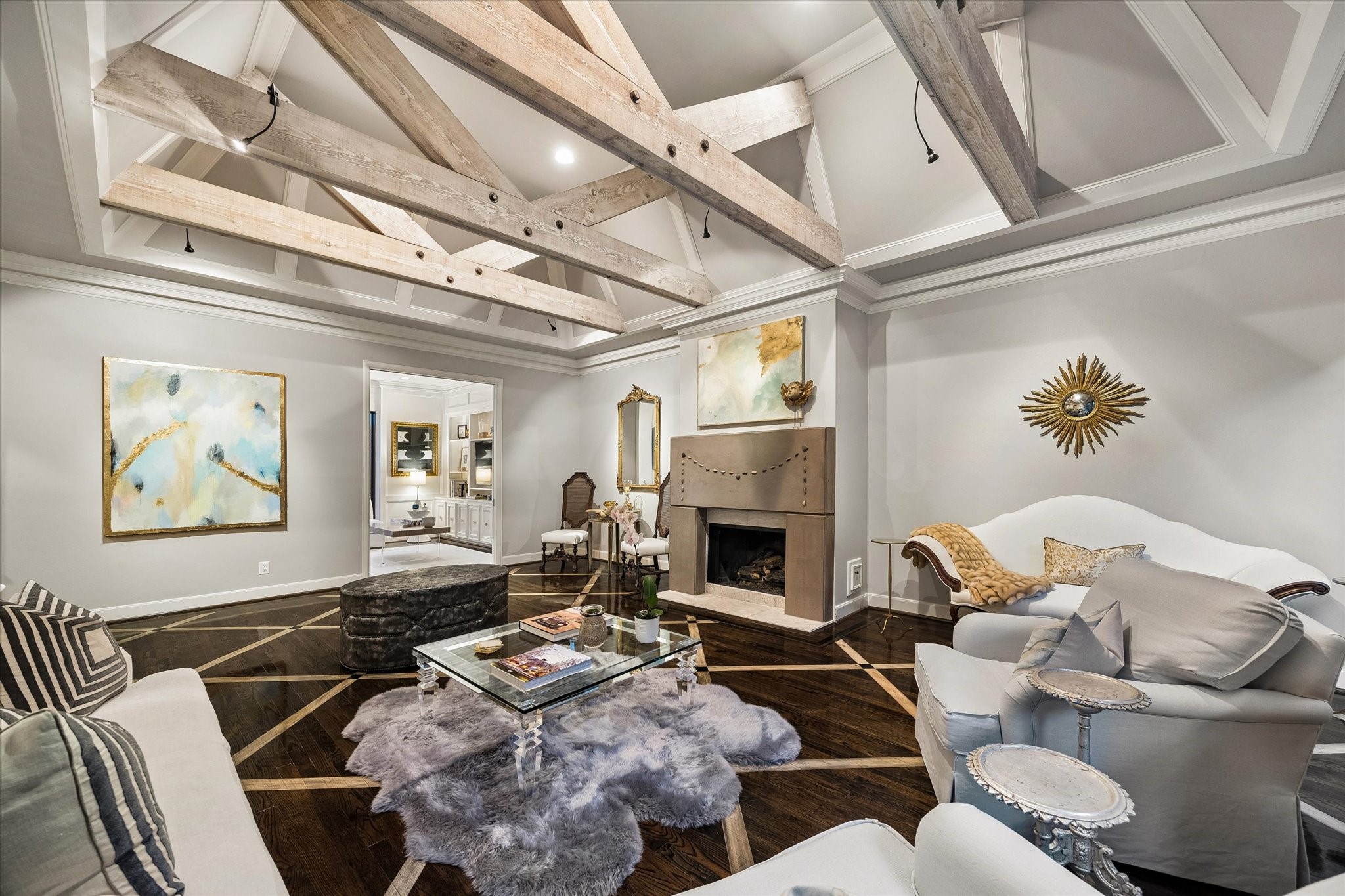 The Great Room is anchored by a wood burning fireplace with gas logs.  Around the circumference of the Great Room are large walls for your treasured artwork.
