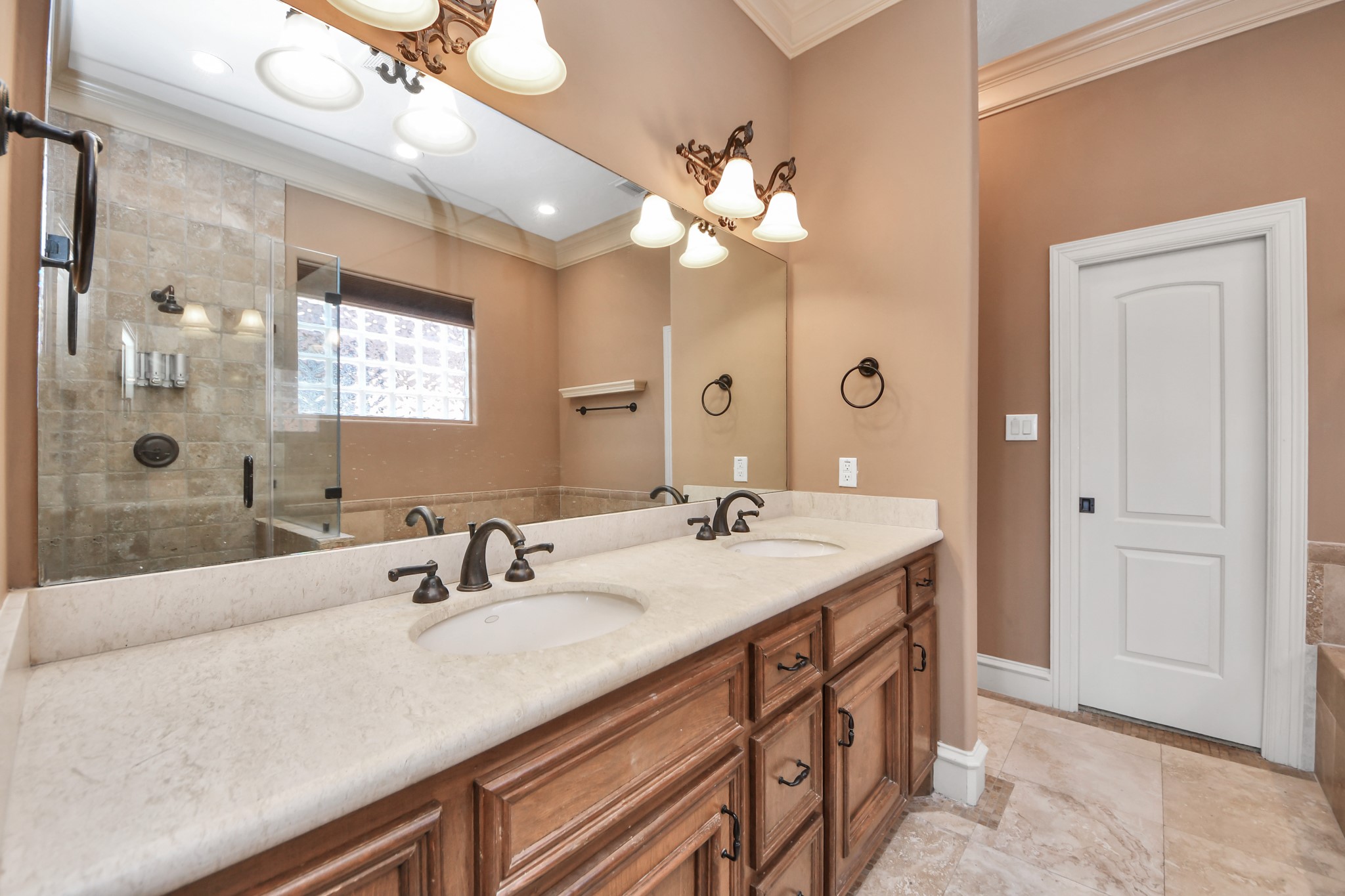 Primary bathroom featuring dual sinks.
