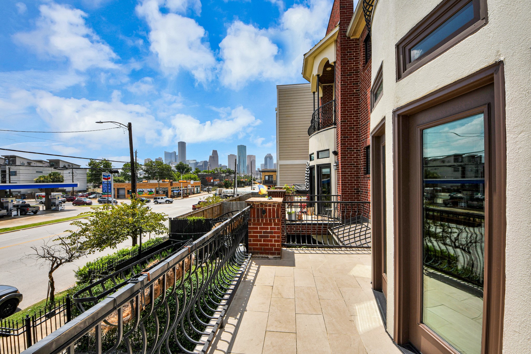 Spacious balcony with views of downtown skyline.