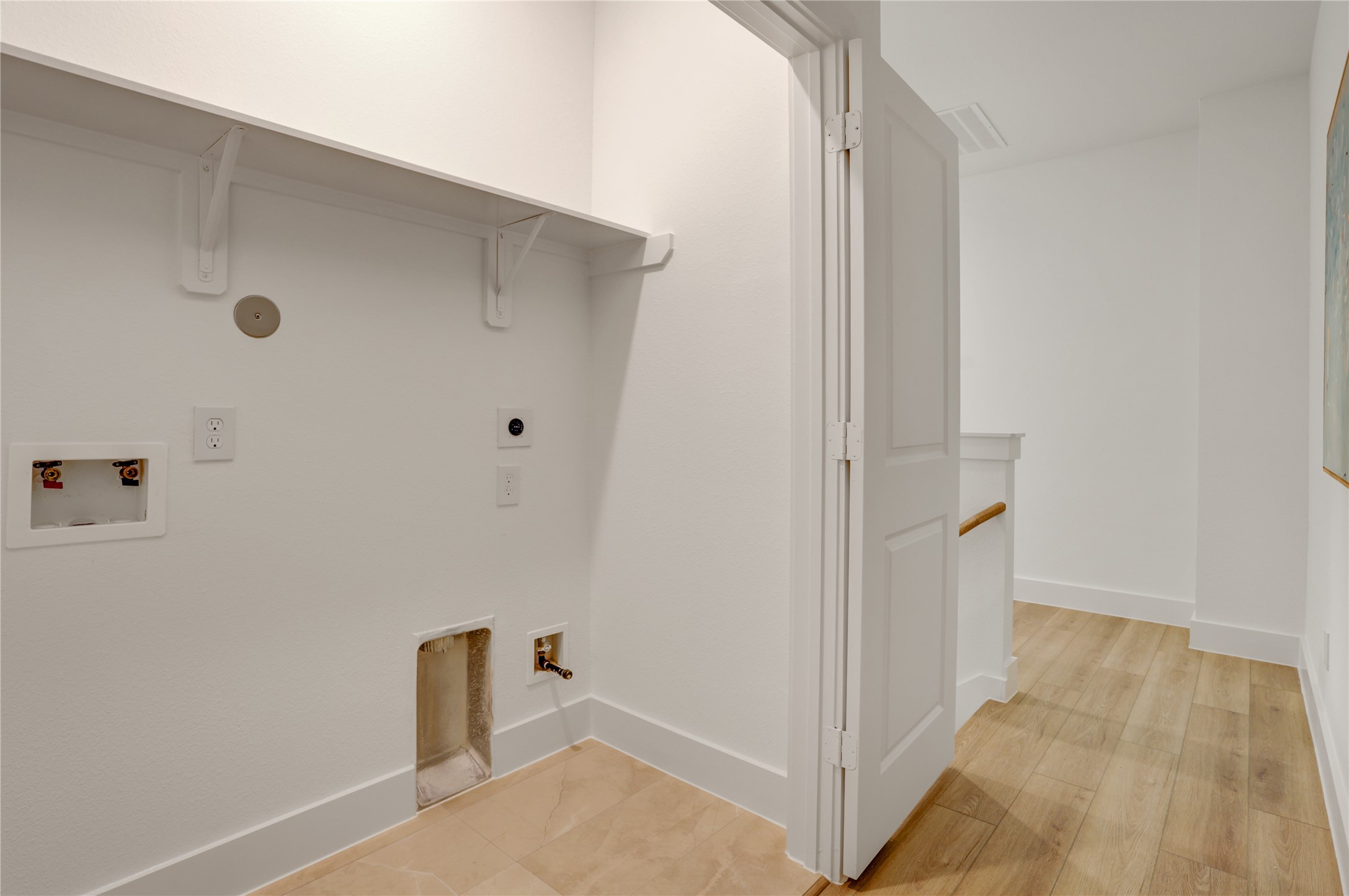 The 3x6 utility room has tile floor and built in shelf.