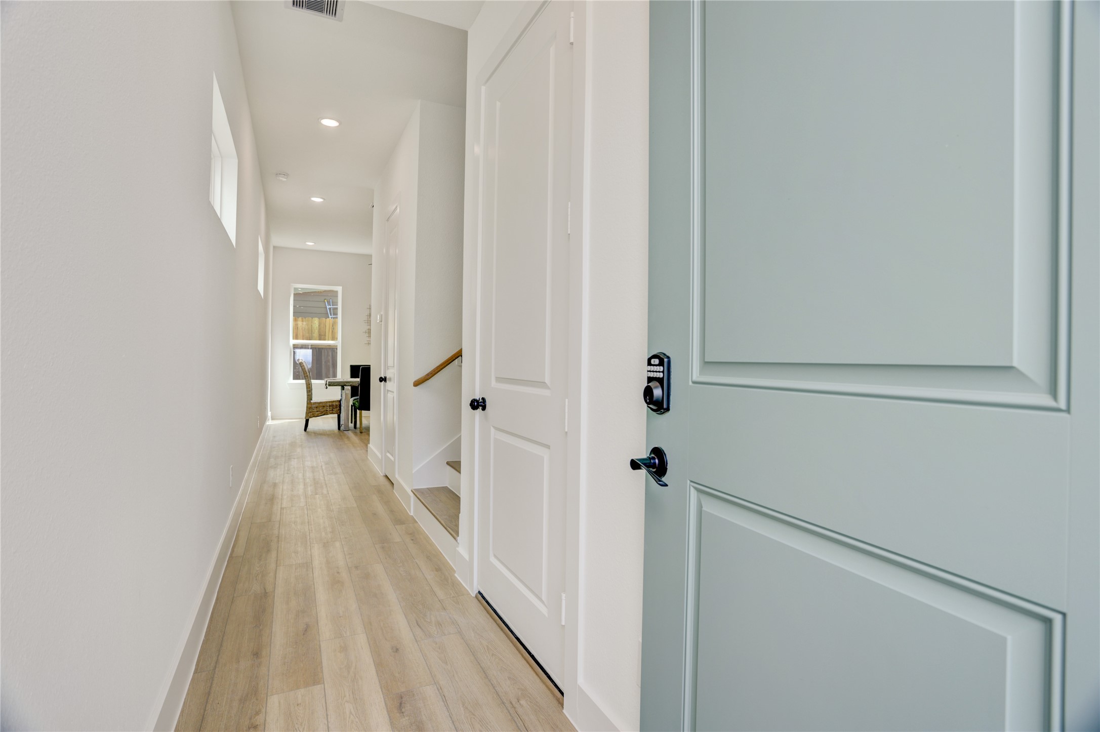Upon entering, the home has a long gallery hallway - perfect for displaying artwork. Upon entering, the home has a long gallery hallway - perfect for displaying artwork.