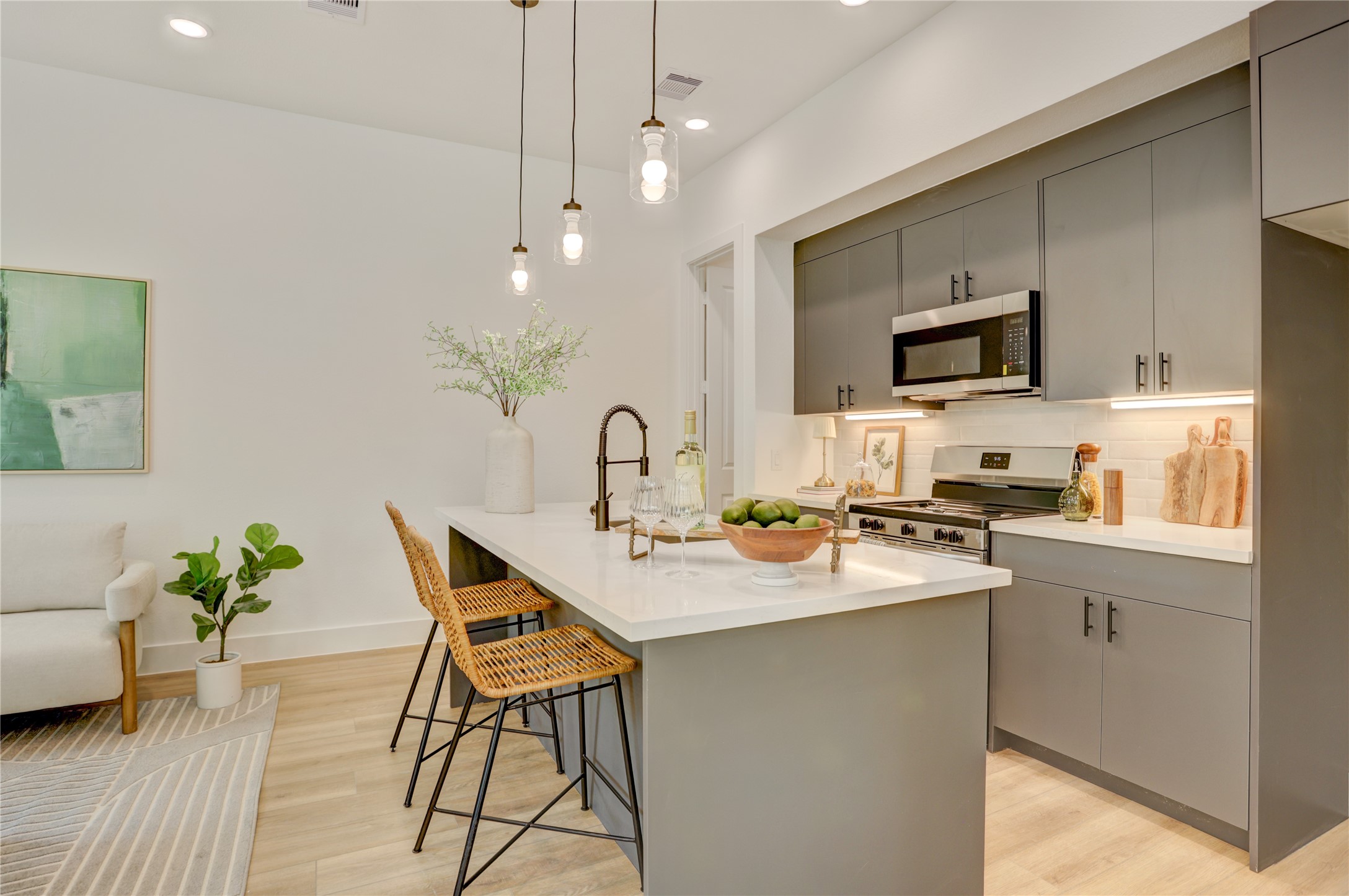 The 10x15 kitchen has 3cm quartz counters and top-of-the-line Frigidaire stainless steel appliances.