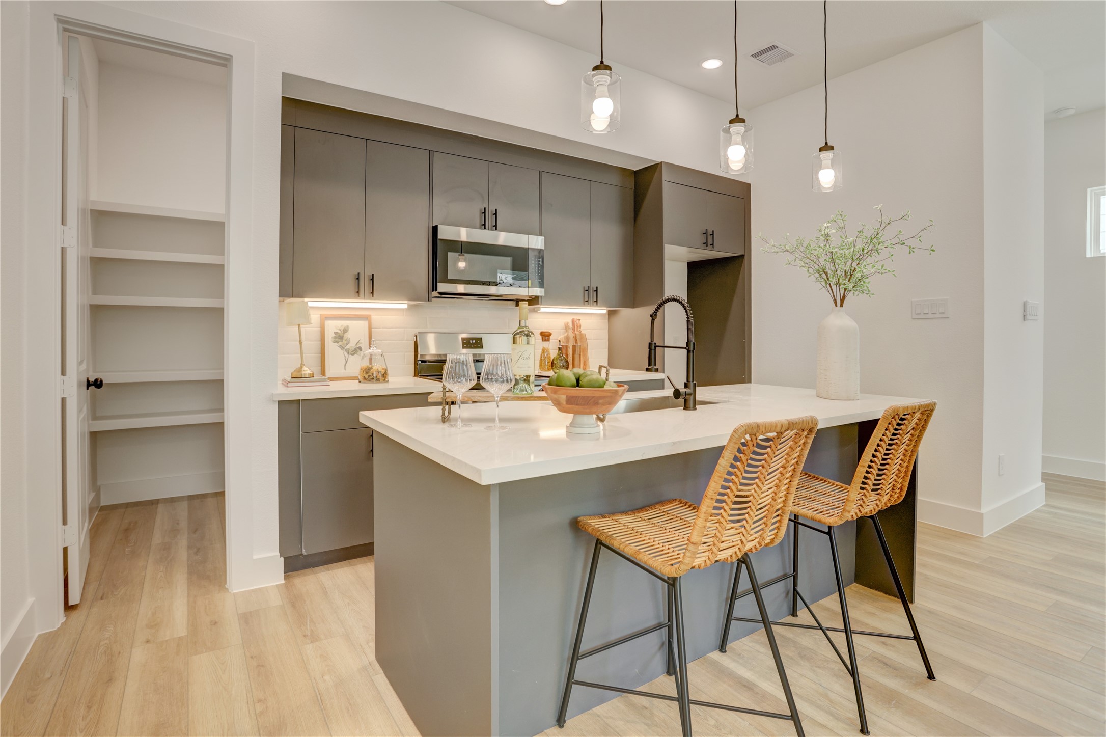 Island kitchen with walk-in pantry. Island kitchen with walk-in pantry.