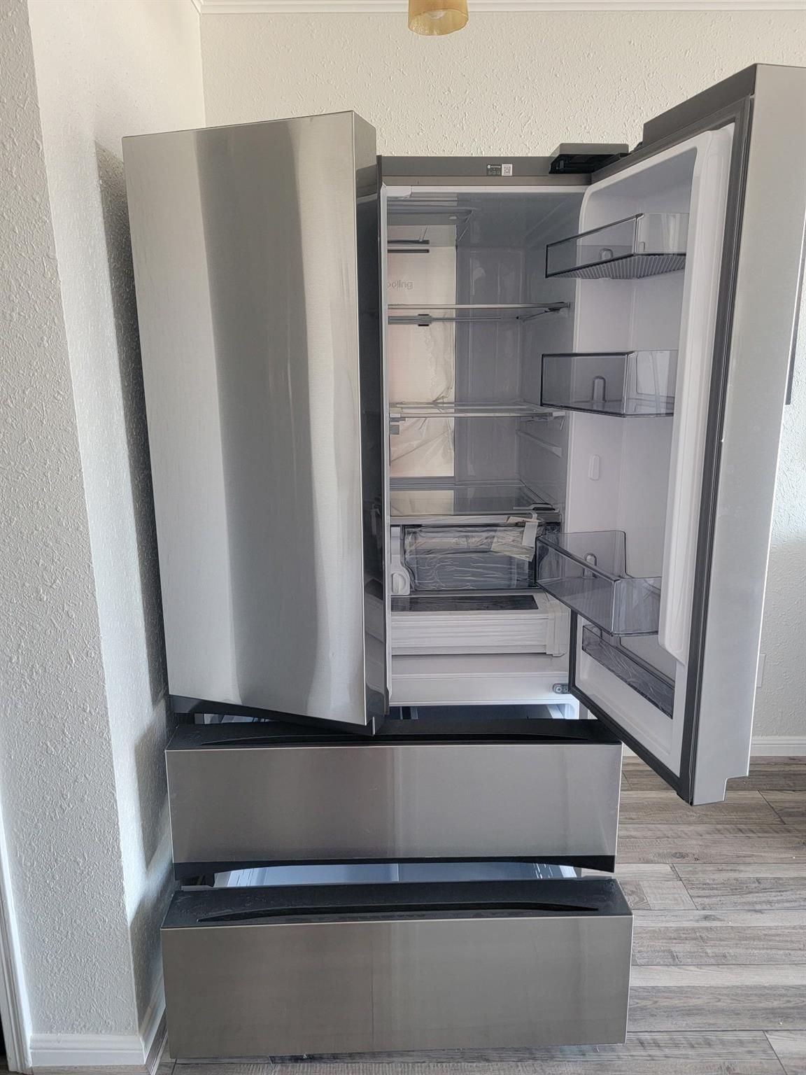 Large LG refrigerator conveys
