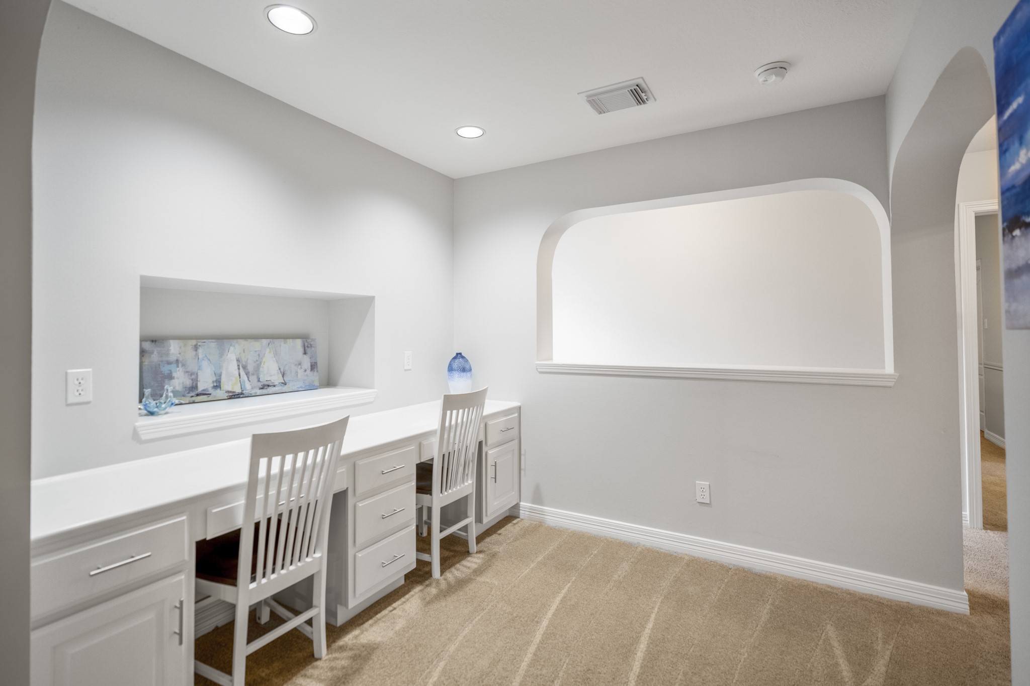 Ideal for your overflow homework / study needs is this study nook, featuring built-ins that easily accommodates two members of your team, with additional storage and drawer space.