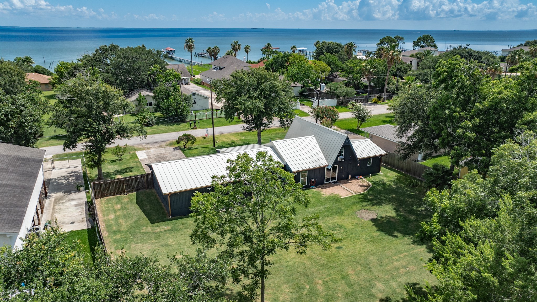 Another look  at the big back yard - notice on the side of the home, there is a large double gate where you could pull a trailer back there if you wanted to store a boat at home.