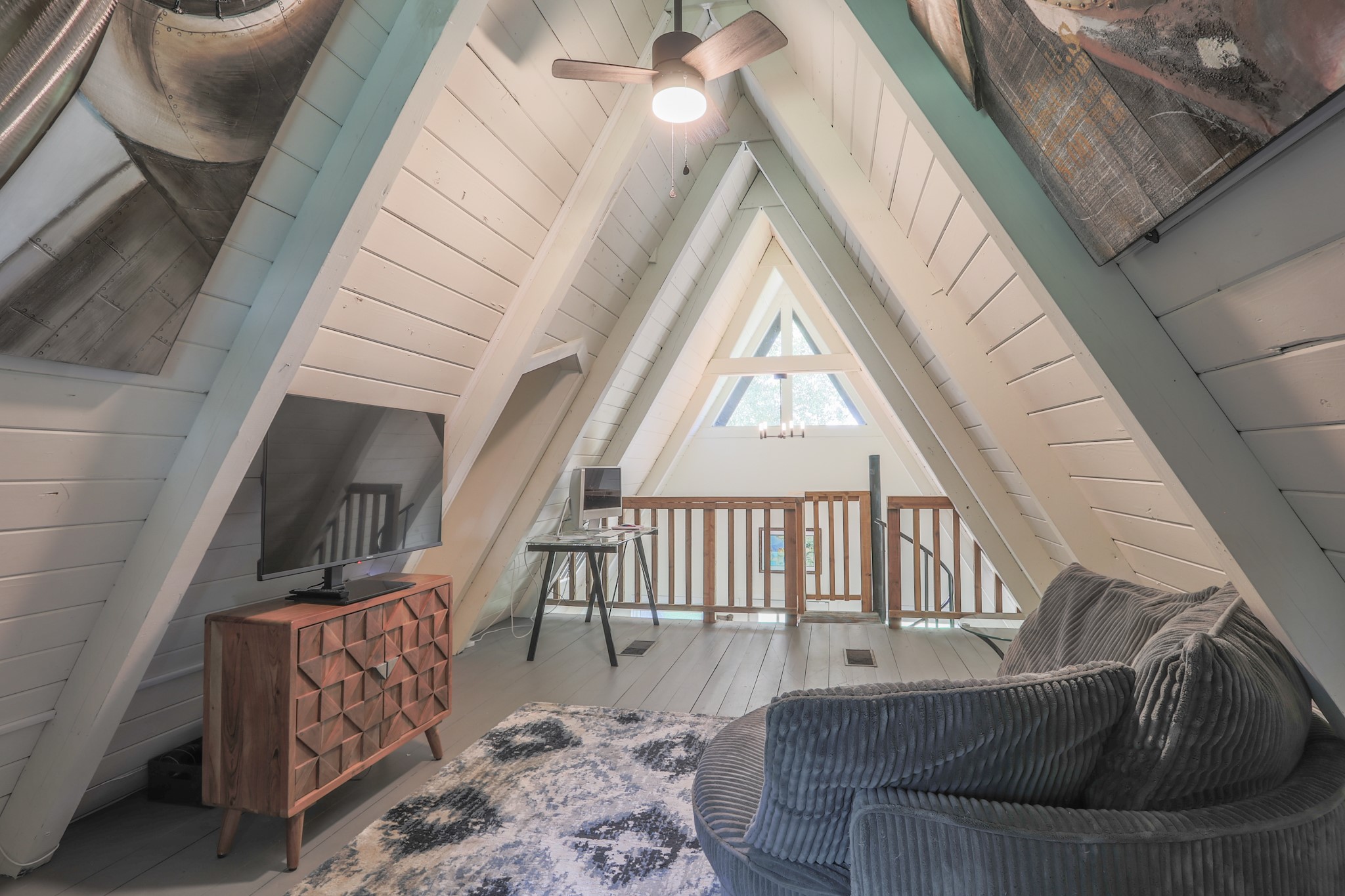 The loft overlooks the entry of the home.