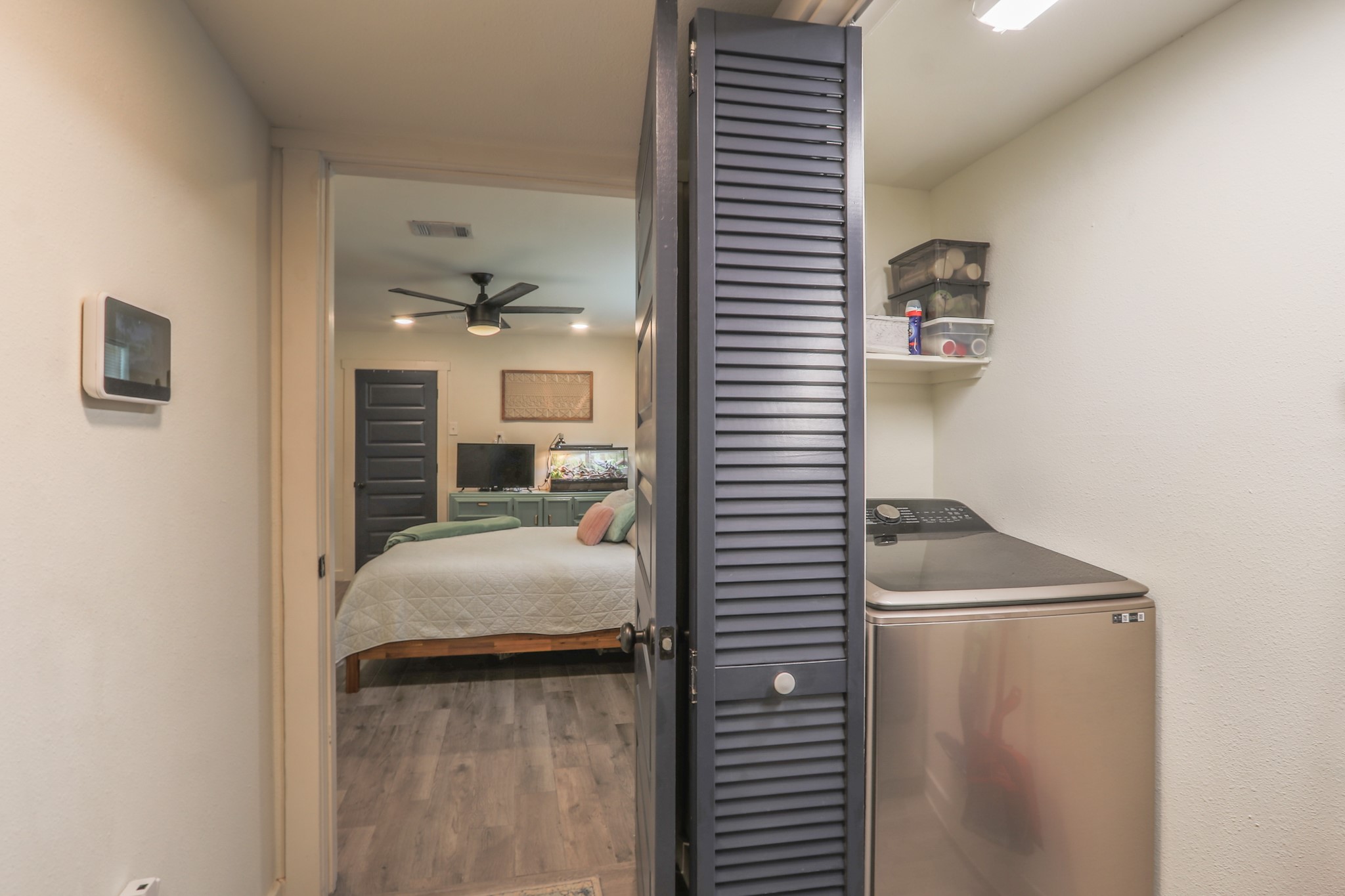 Laundry Room is conveniently located in the hallway, the owners are generously leaving a lovely washer & dryer set for the new owner.   There is storage over both units and space in between for storing your cleaning tools.