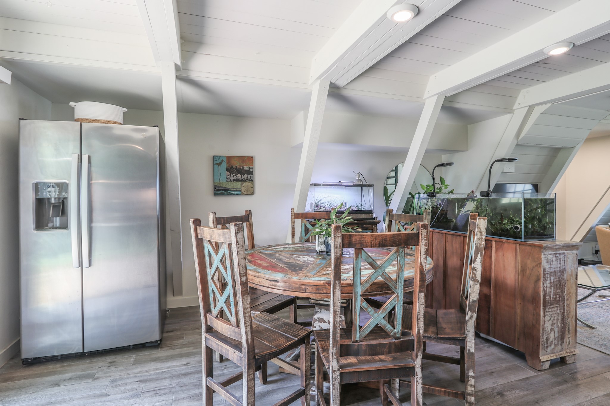 The Breakfast Space...  The owners are graciously leaving the refrigerator, dining table and 6 chairs as well as a small buffet that matches the set... All of this goes with the island in the kitchen and just looks like it belongs in this fabulous home.