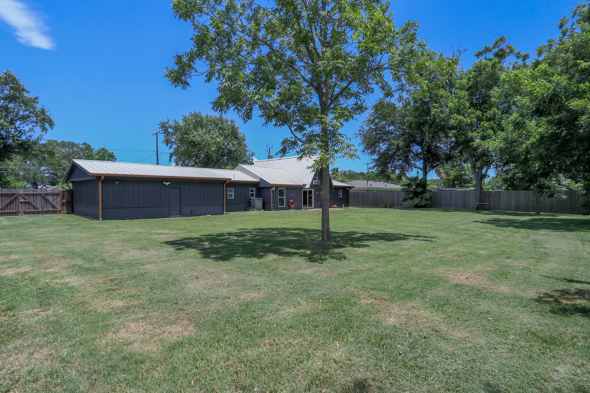 Huge Back Yard - Huge!   There was a pool here in the past that the previous resident didn't keep but you could do something like that or have a large covered patio and beautiful gardens... The possibilities are truly as big as your imagination!