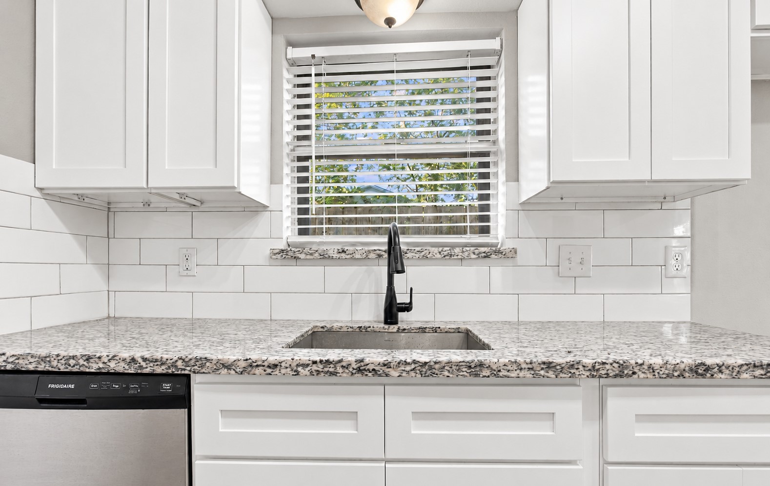 A close up of the sink - the home comes with an dishwasher as well!