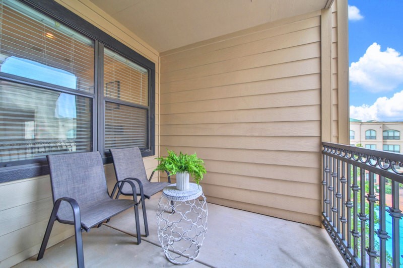ENJOY The views form the ample balcony, where you can overlook the courtyard and OASIS-STYLE Sparkling pool.
