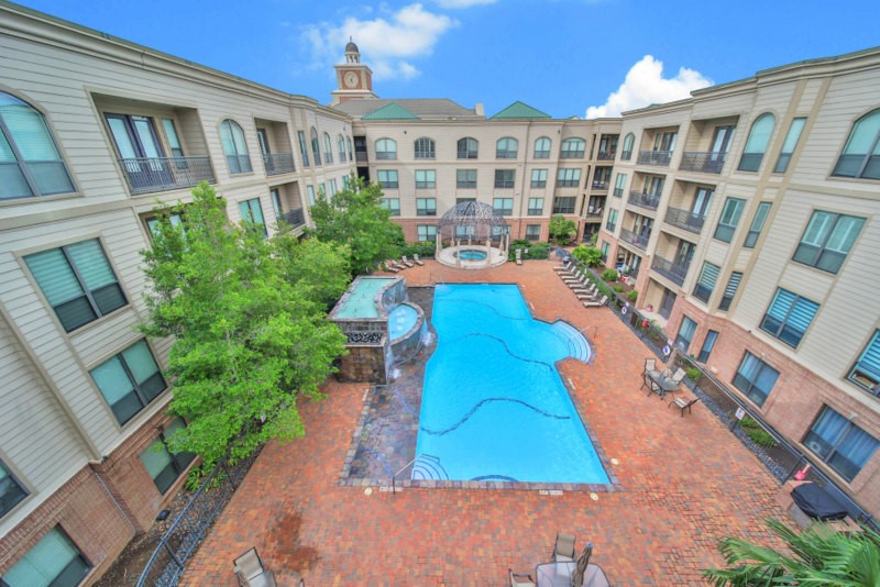 While sipping your daily morning coffee from the living room, ENJOY Peaceful views overlooking courtyard and sparking oasis-style pool.