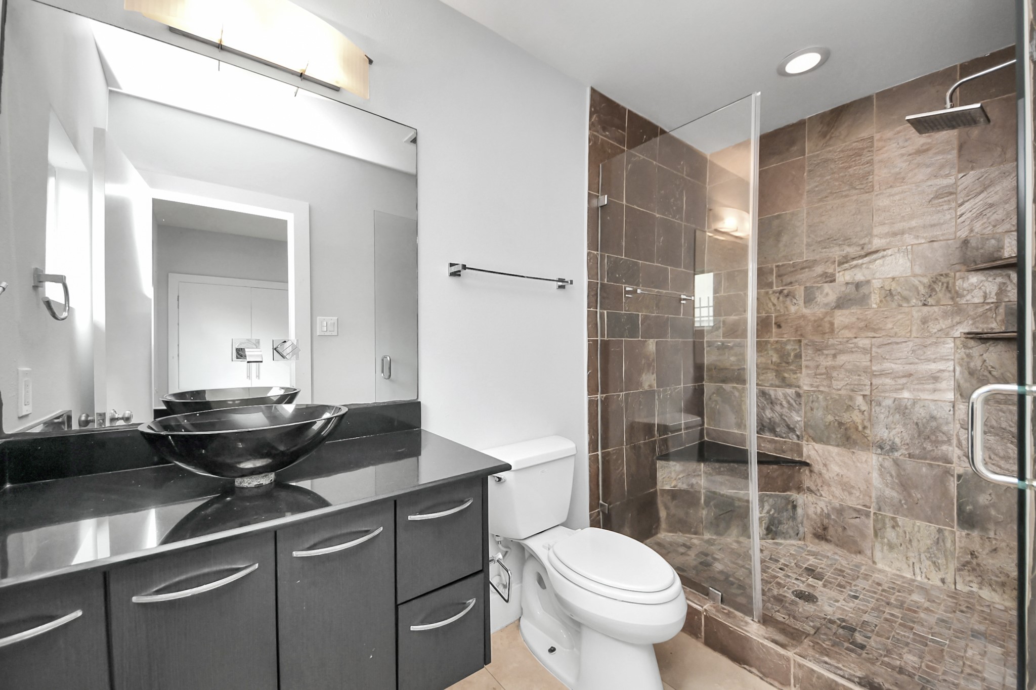First-floor bedroom with a private full bathroom, ideal for guests.