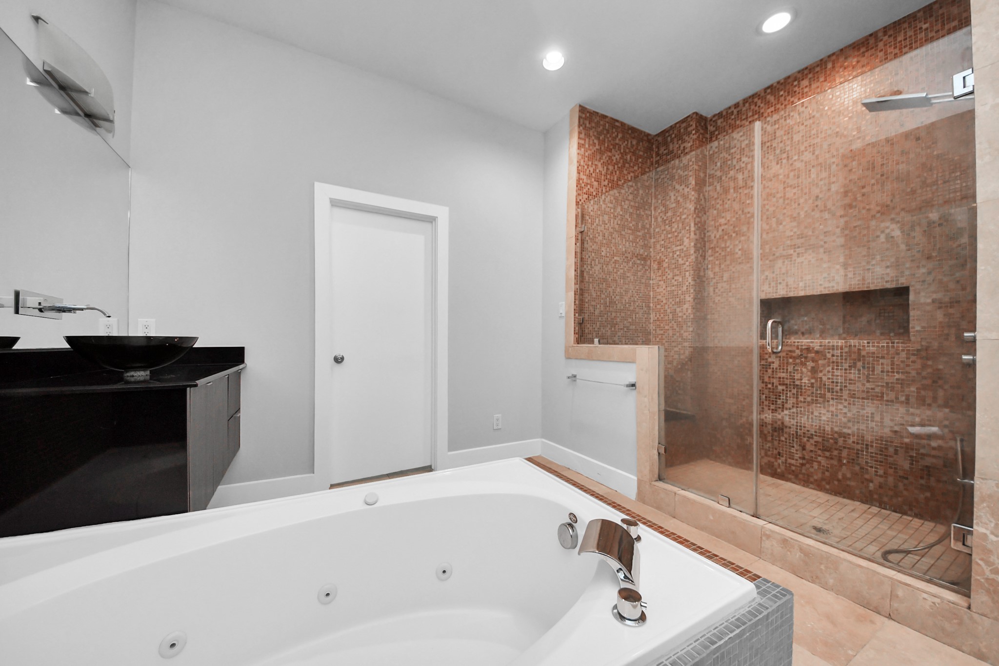First-floor bedroom with a private full bathroom, ideal for guests.