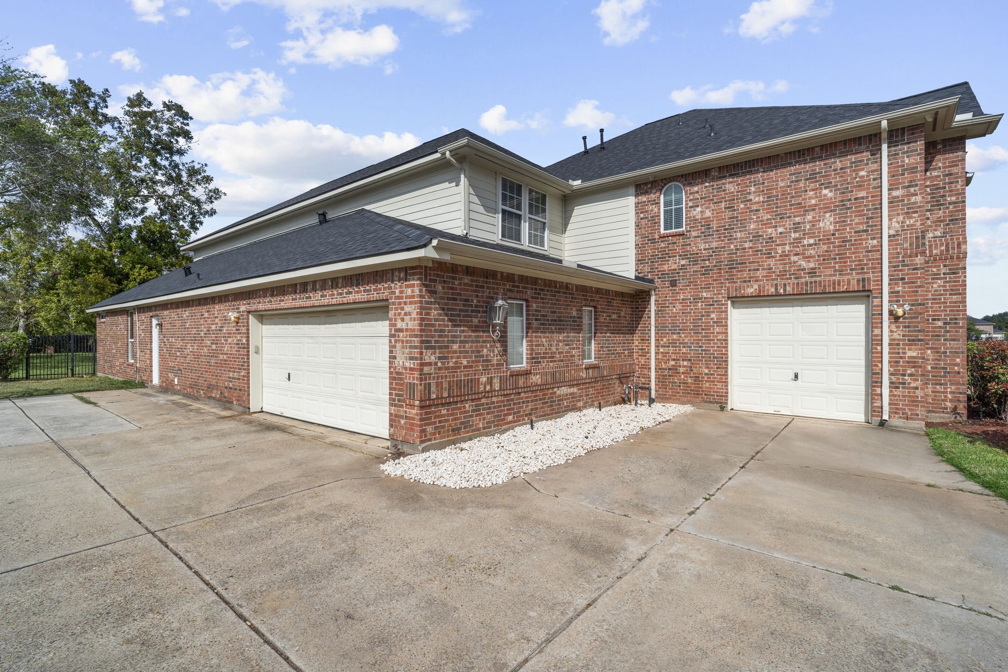 offering 3Offering a spacious three-car garage with generous additional parking for guests and extra vehicles. car garage