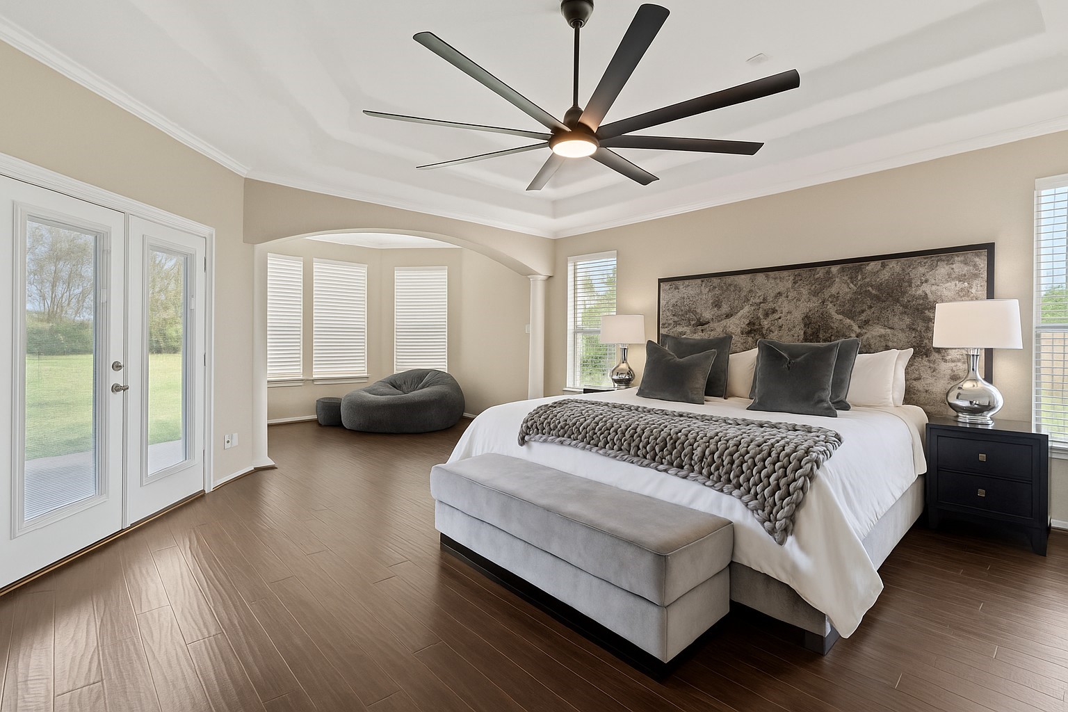 Expansive primary suite featuring a private sitting area, creating a peaceful retreat for relaxation and unwinding.